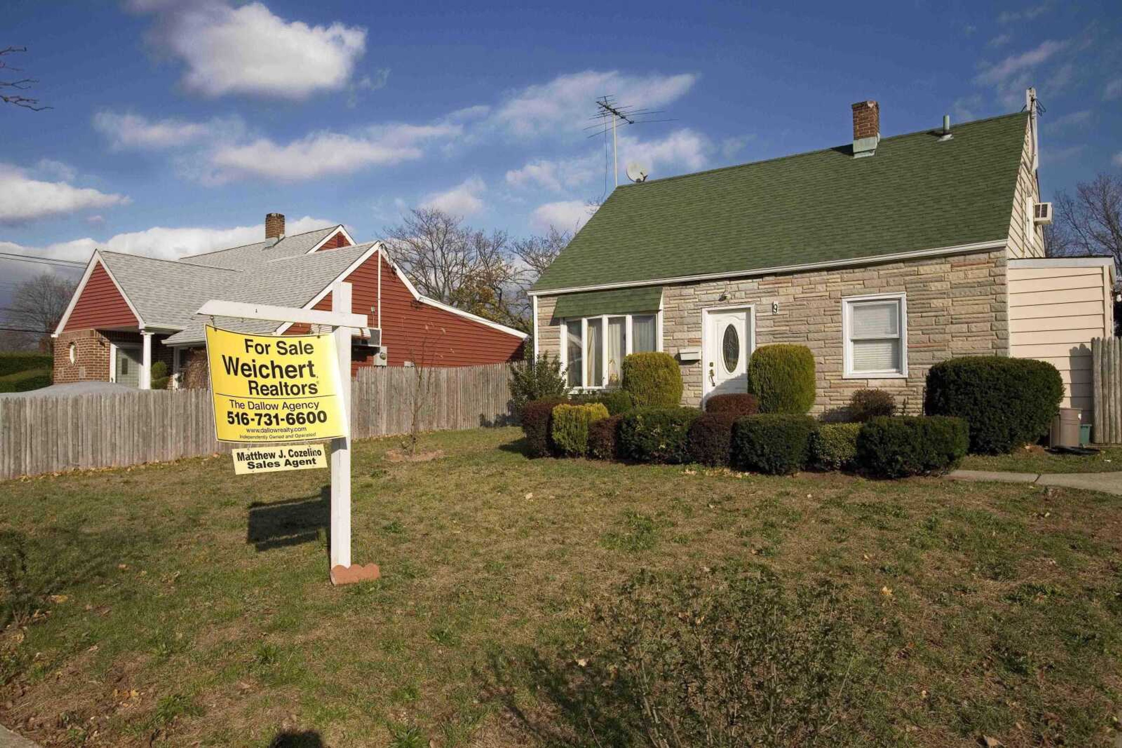 Associated Press file<br>A home in Levittown, N.Y. is facing foreclosure in this Nov. 20 photo, according to the records of Nassau County. The foreclosure crisis now is being fueled by a spike in defaults in states like Louisiana, New York, Georgia and Texas, where the economies are rapidly deteriorating and thousands are losing their jobs.