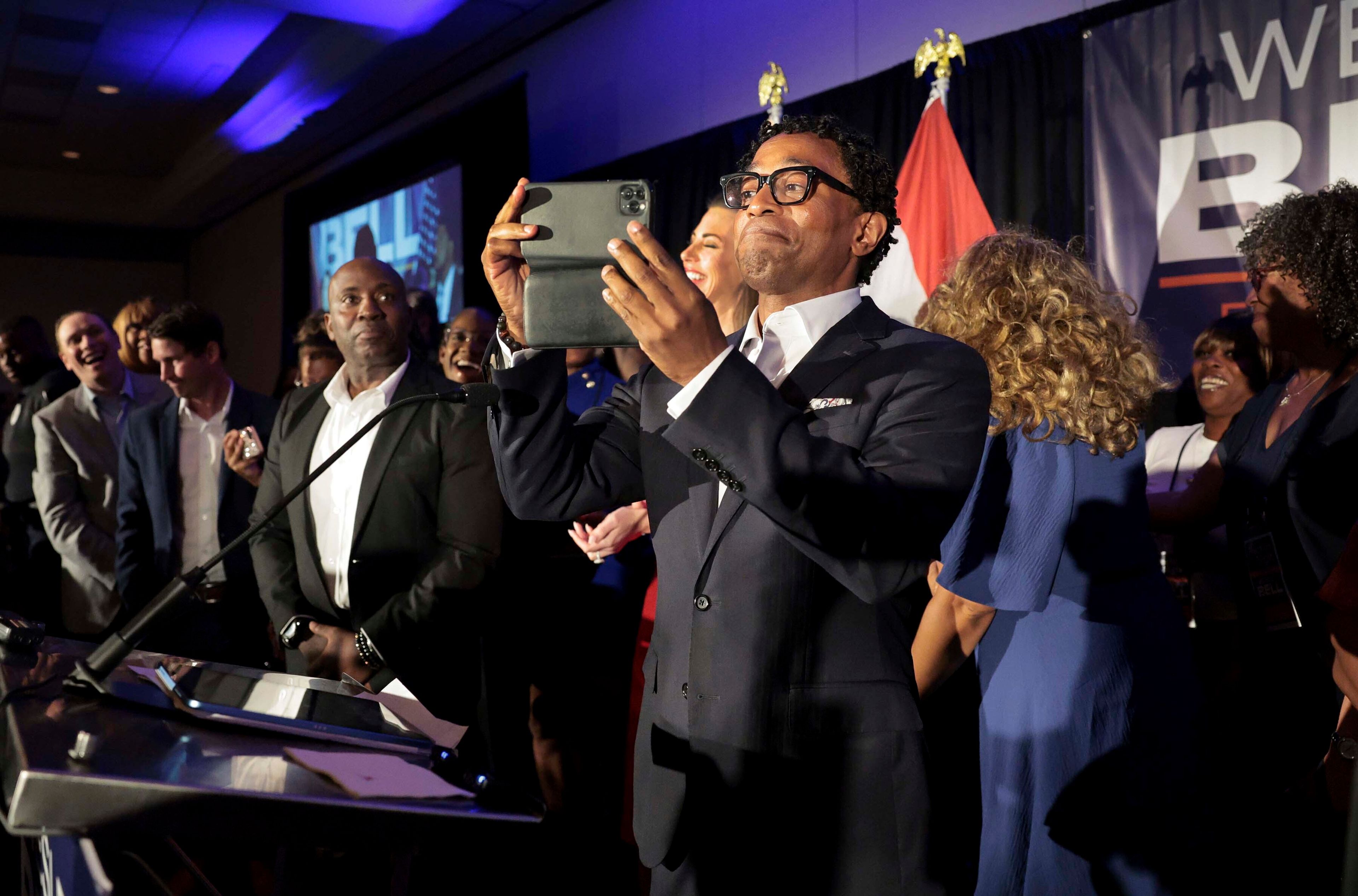 Wesley Bell takes a video of his supporters as he takes the stage as the winner of the Democratic congressional primary against incumbent U.S. Rep. Cori Bush on Tuesday, Aug. 6, 2024, in St. Louis. (Robert Cohen/St. Louis Post-Dispatch via AP)