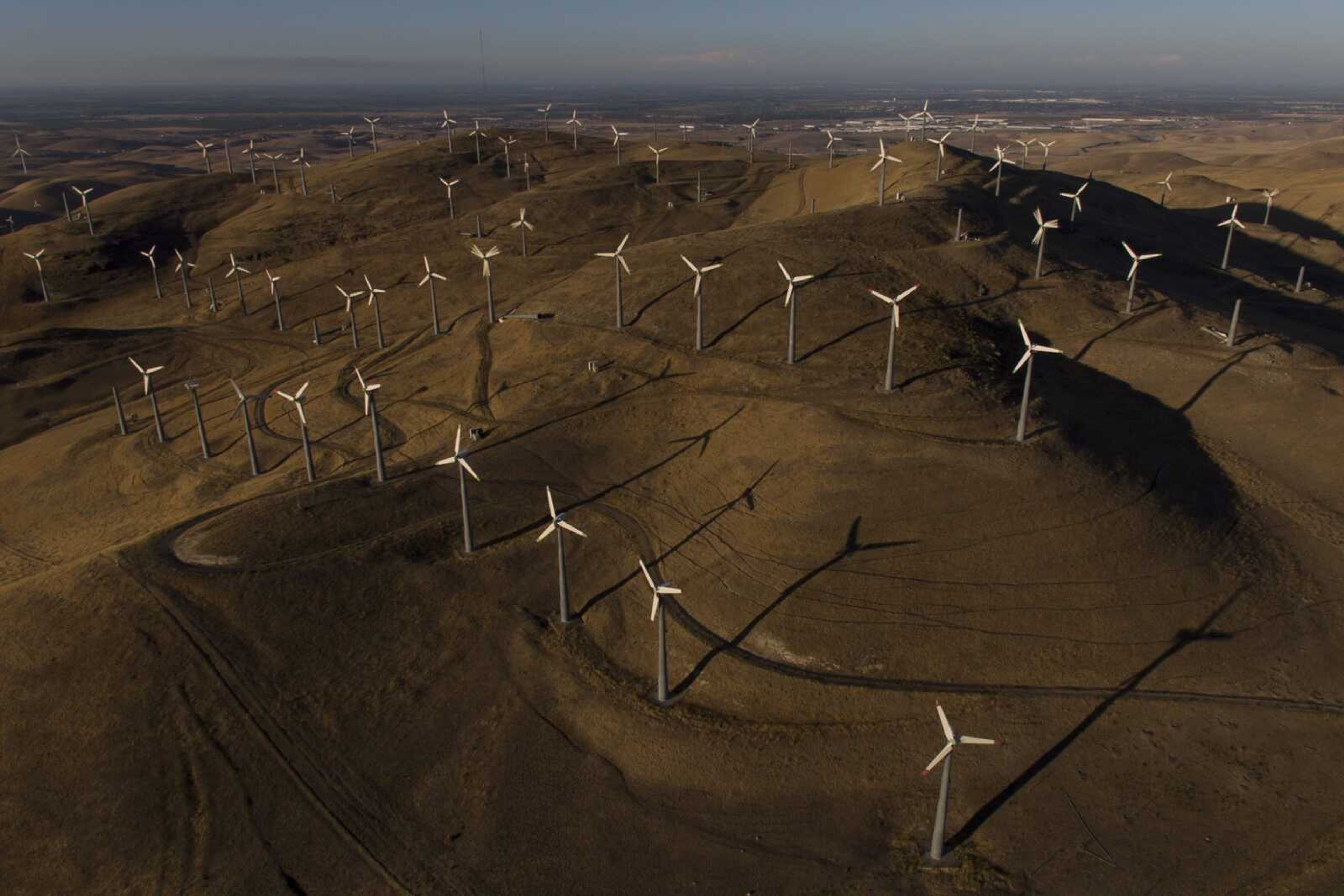 Wind turbines work Wednesday in Livermore, California.