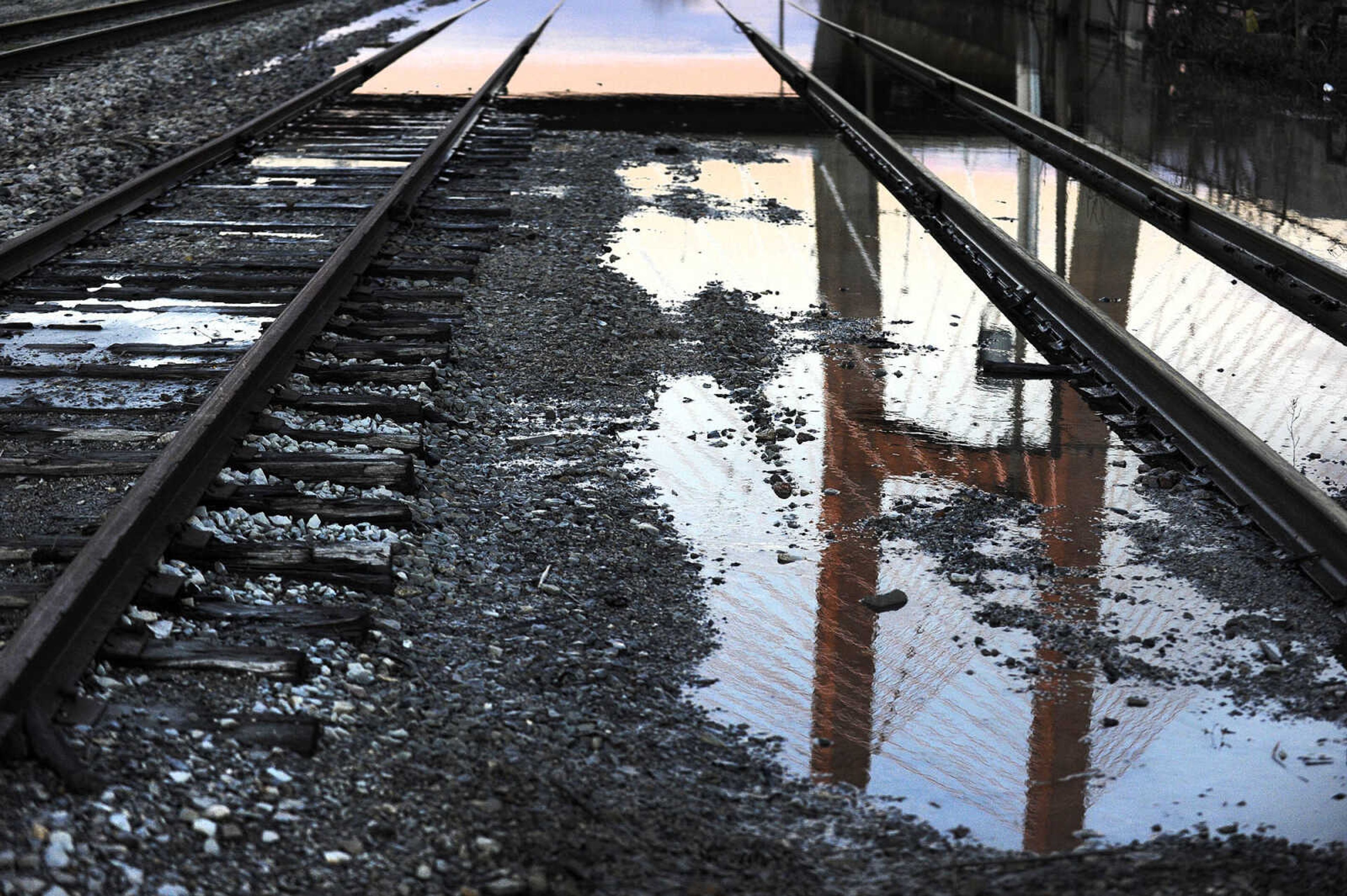 LAURA SIMON ~ lsimon@semissourian.com

The Bill Emerson Memorial Bridge is reflected in receding floodwater along the train tracks near the Missouri Dry Dock in Cape Girardeau, Monday, Jan. 4, 2016.