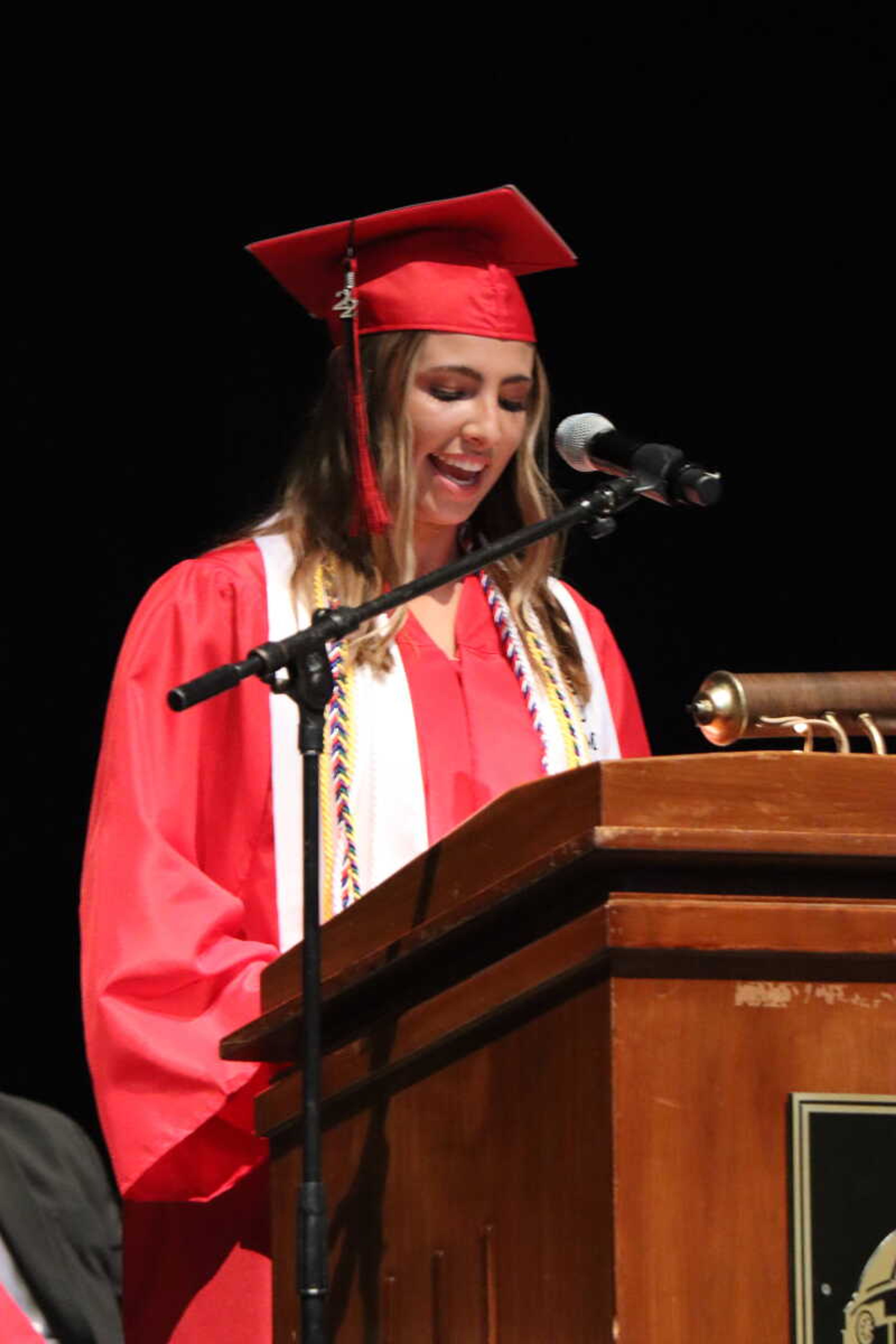 Emma Shields introduces Andy Helle to give the commencement speech.