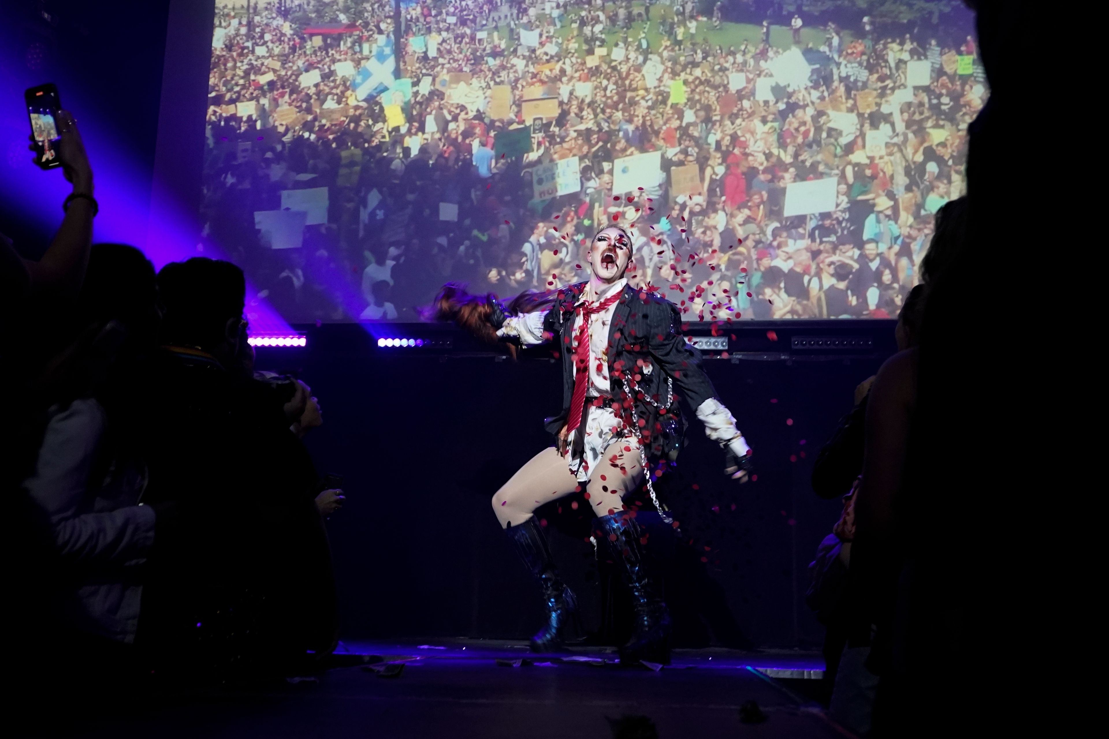 Pattie Gonia performs at the "Save Her! Environmental Drag Show" during Climate Week, Tuesday, Sept. 24, 2024, in the Brooklyn borough of New York. (AP Photo/Alyssa Goodman)