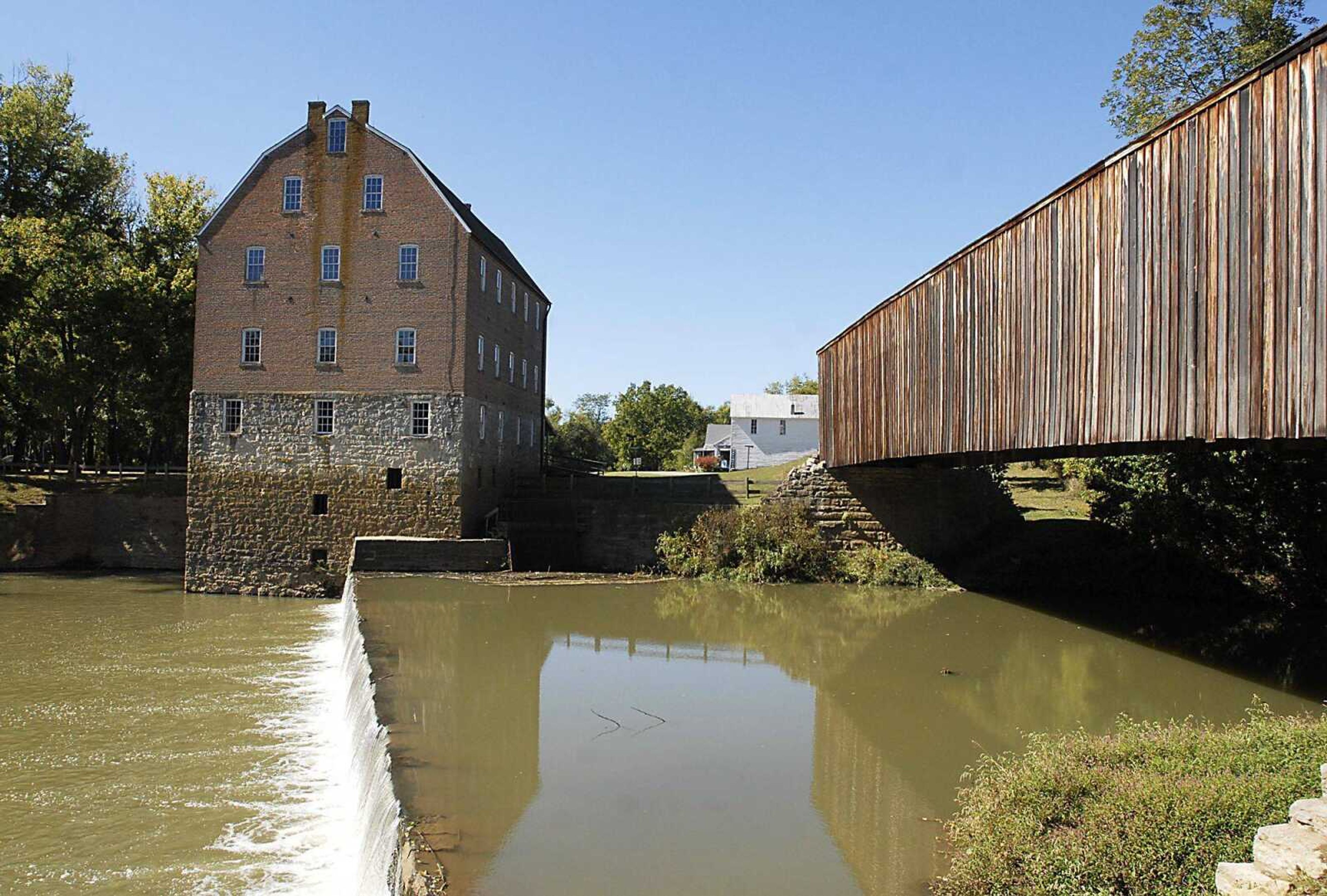 Bollinger Mill State Historic site administrator Lesley McDaniel said that recent rains made the Whitewater River top the dam for the first time in a while under the Burfordville Covered Bridge.