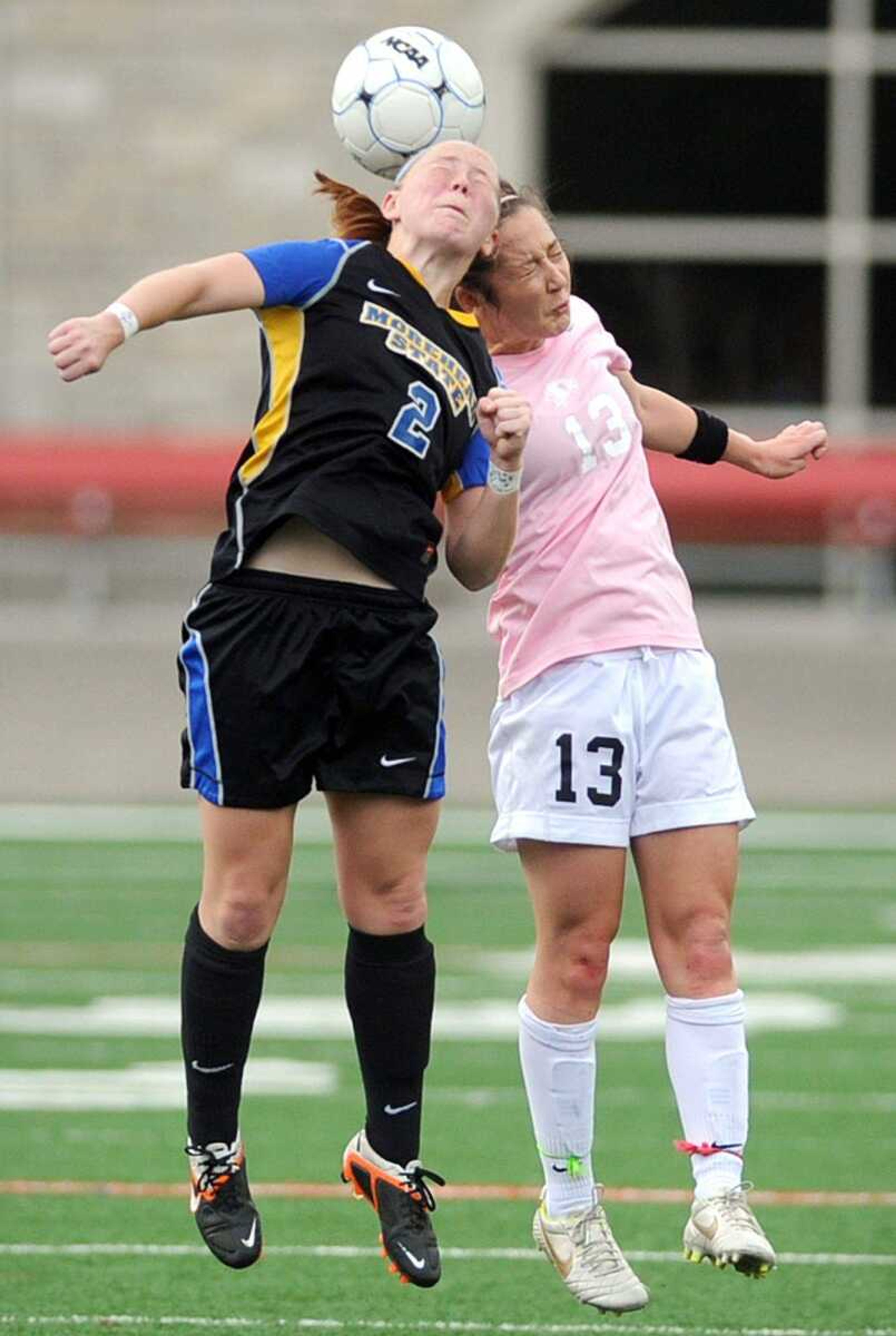 Morehead State forward Holly Tilley, left, and Southeast midfielder Jenna Collingridge collide trying to head the ball during the first half Sunday at Houck Stadium. (Laura Simon)