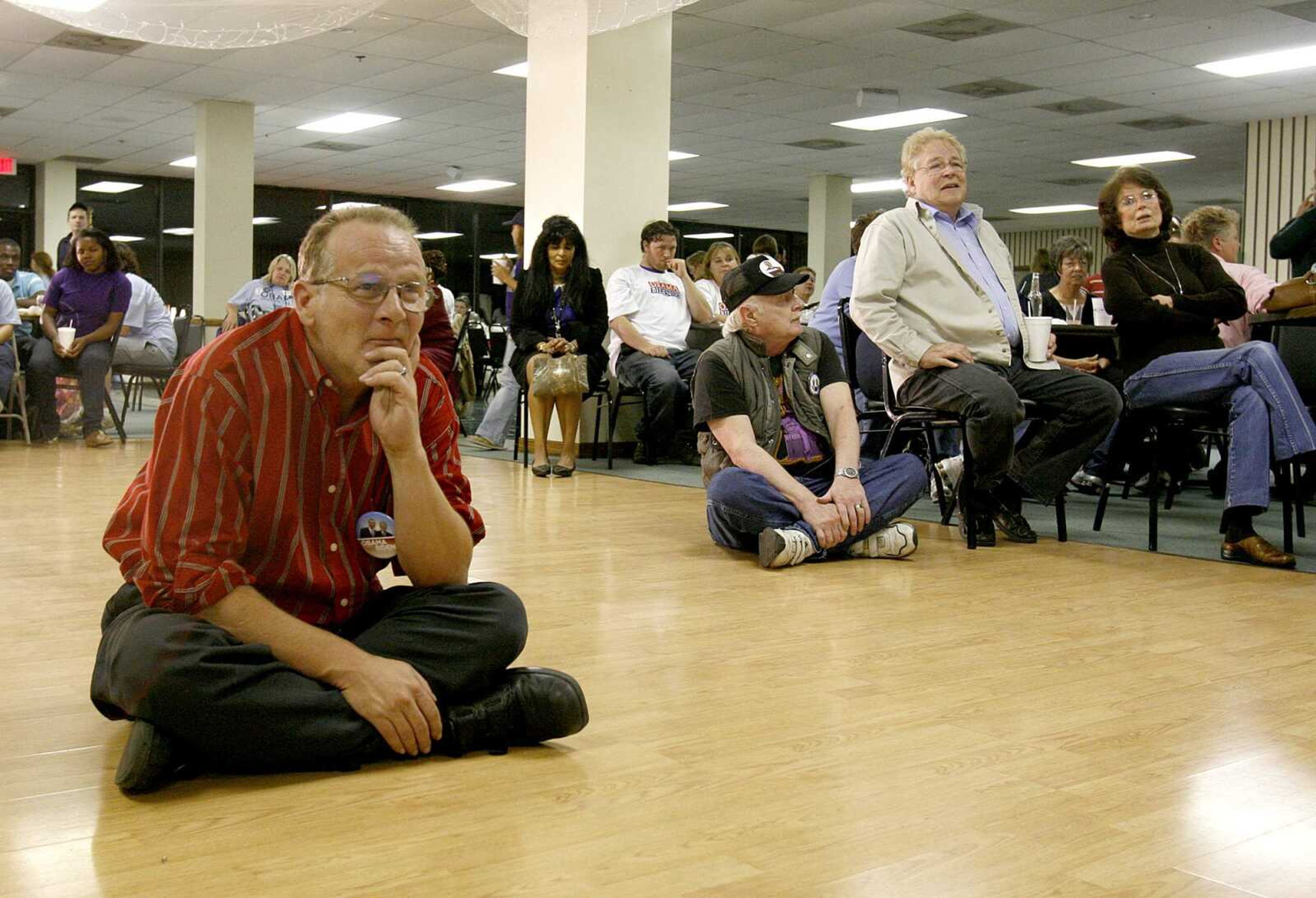 ELIZABETH DODD ~ edodd@semissourian.com
Jeff F. Hale, of Cape Girardeau, moves to the floor at the Elks Lodge for a better look at the results as they come in.