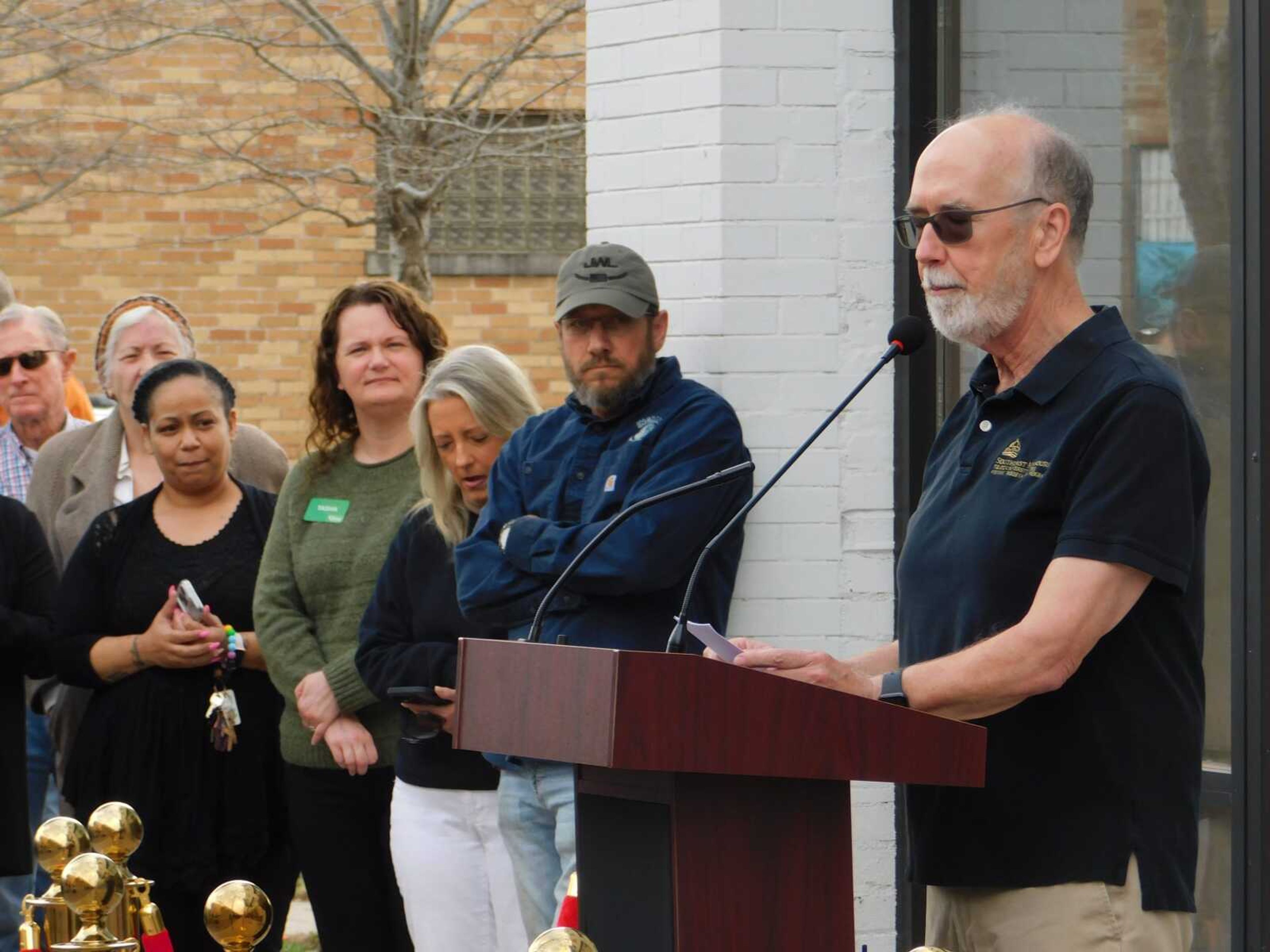 Southeast Missouri State University professor Steven Hoffman speaks during the sign reveal of the redeveloped Broadway Theatre building Wednesday, March 13. He was one of those who had advocated for the building to be restored instead of demolished.