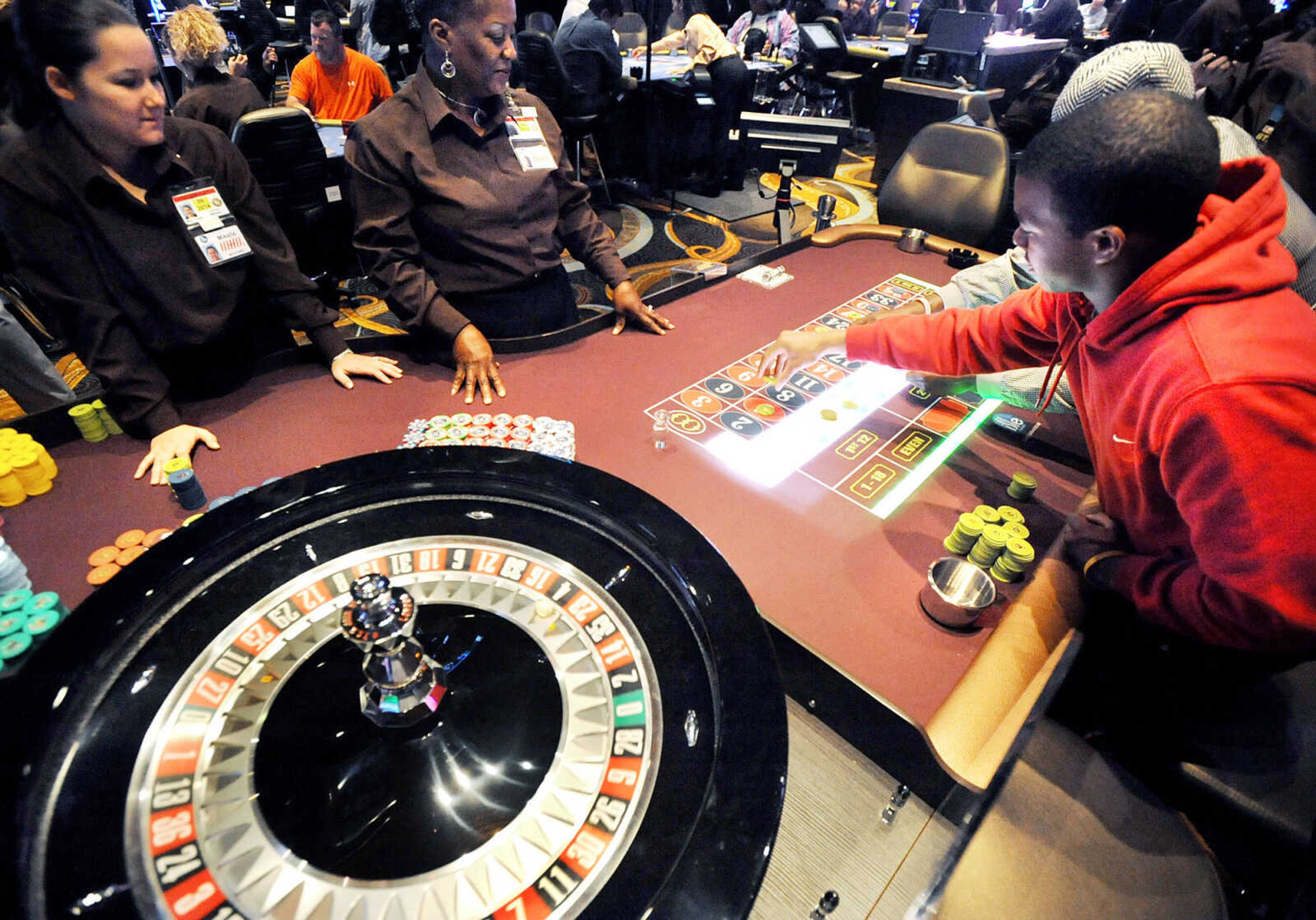 LAURA SIMON ~ lsimon@semissourian.com
Southeast Missouri State student Jordan Hale places bets on the roulette table Tuesday, Oct. 30, 2012 during opening day of Isle of Capri in Cape Girardeau. The $135 million casino opened to the public Tuesday morning.