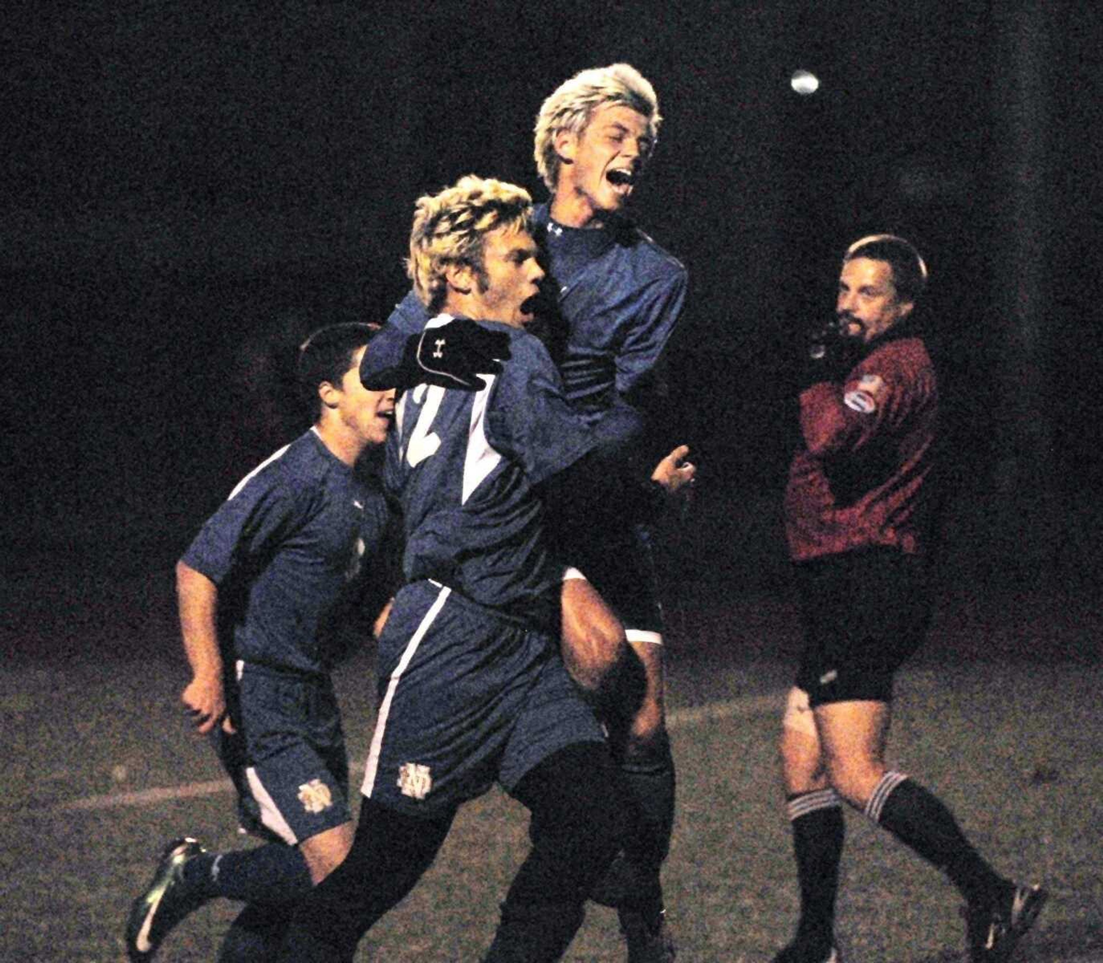 CHUCK WU ~ cwu@semissourian.comNotre Dame's John Unterreiner celebrates with teammate Joe Froemsdorf after scoring during the first half against St. Mary's in their Class 2 quarterfinal game at Farmington.