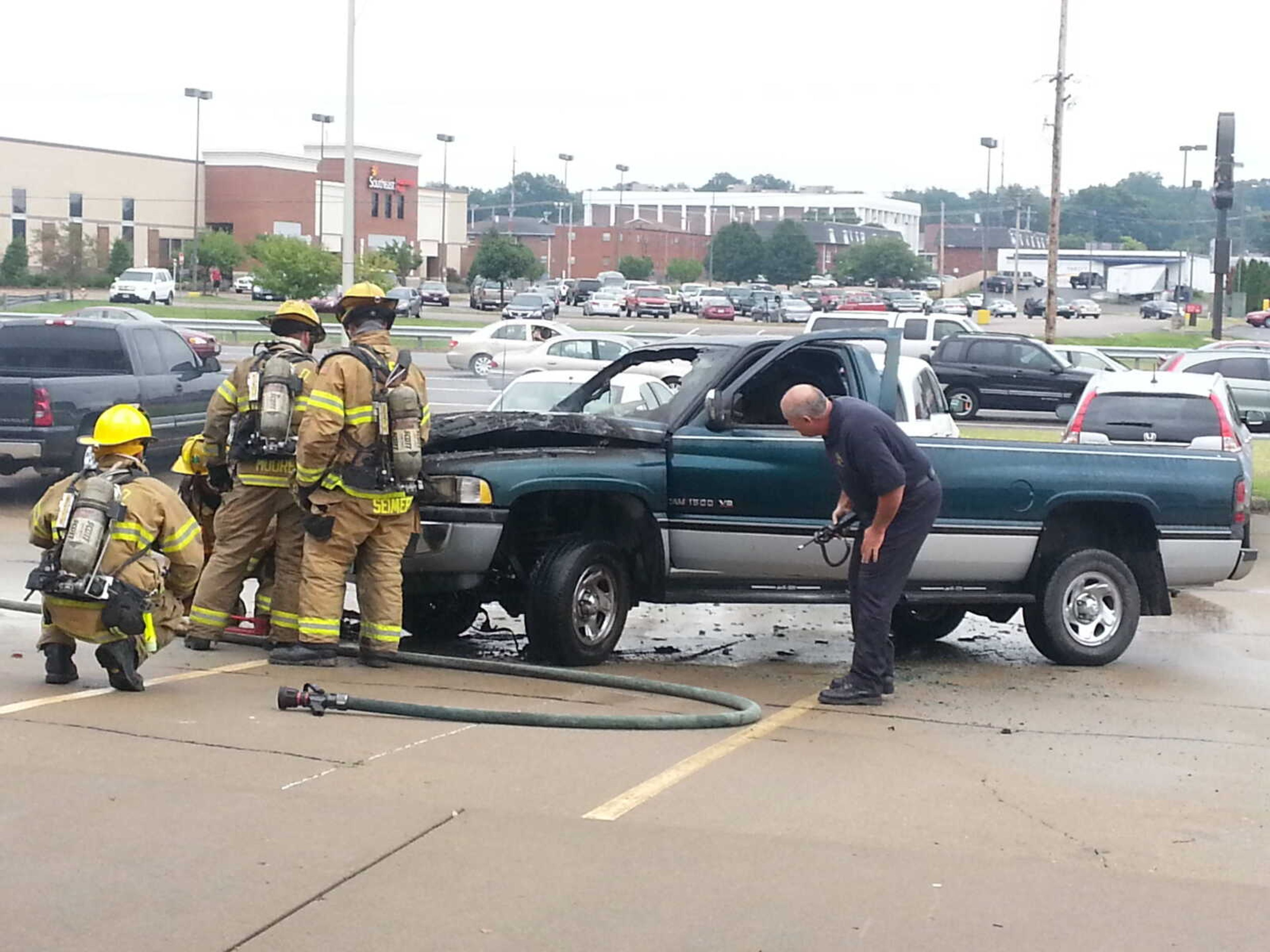 Firefighters put out a truck fire in the parking lot at the strip mall at the corner of Independence and Kingshighway on Tuesday. No injuries were reported.