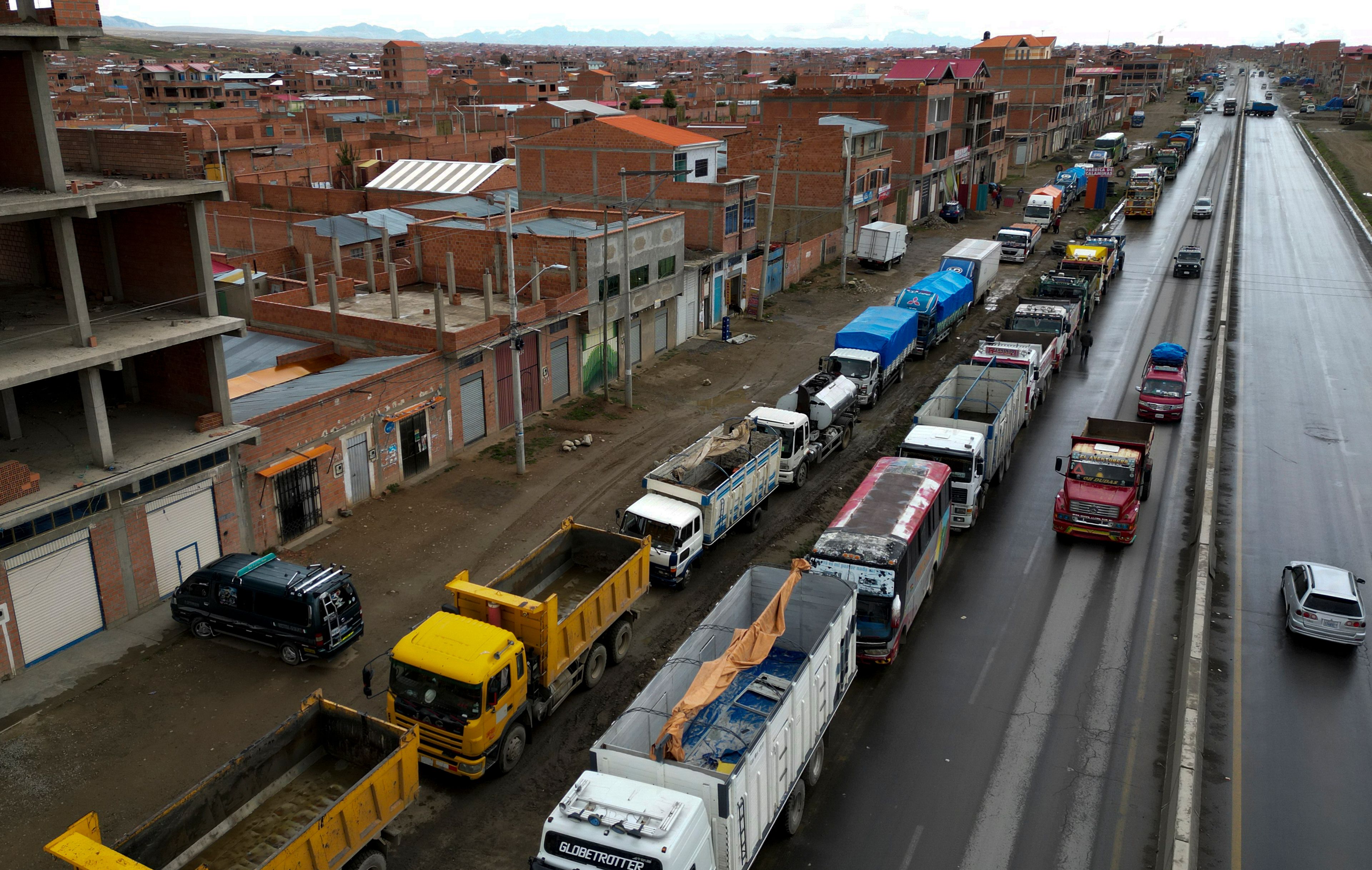 Truck drivers queue up to fill their diesel tanks in El Alto, Bolivia, Tuesday, Nov. 26, 2024. (AP Photo/Juan Karita)