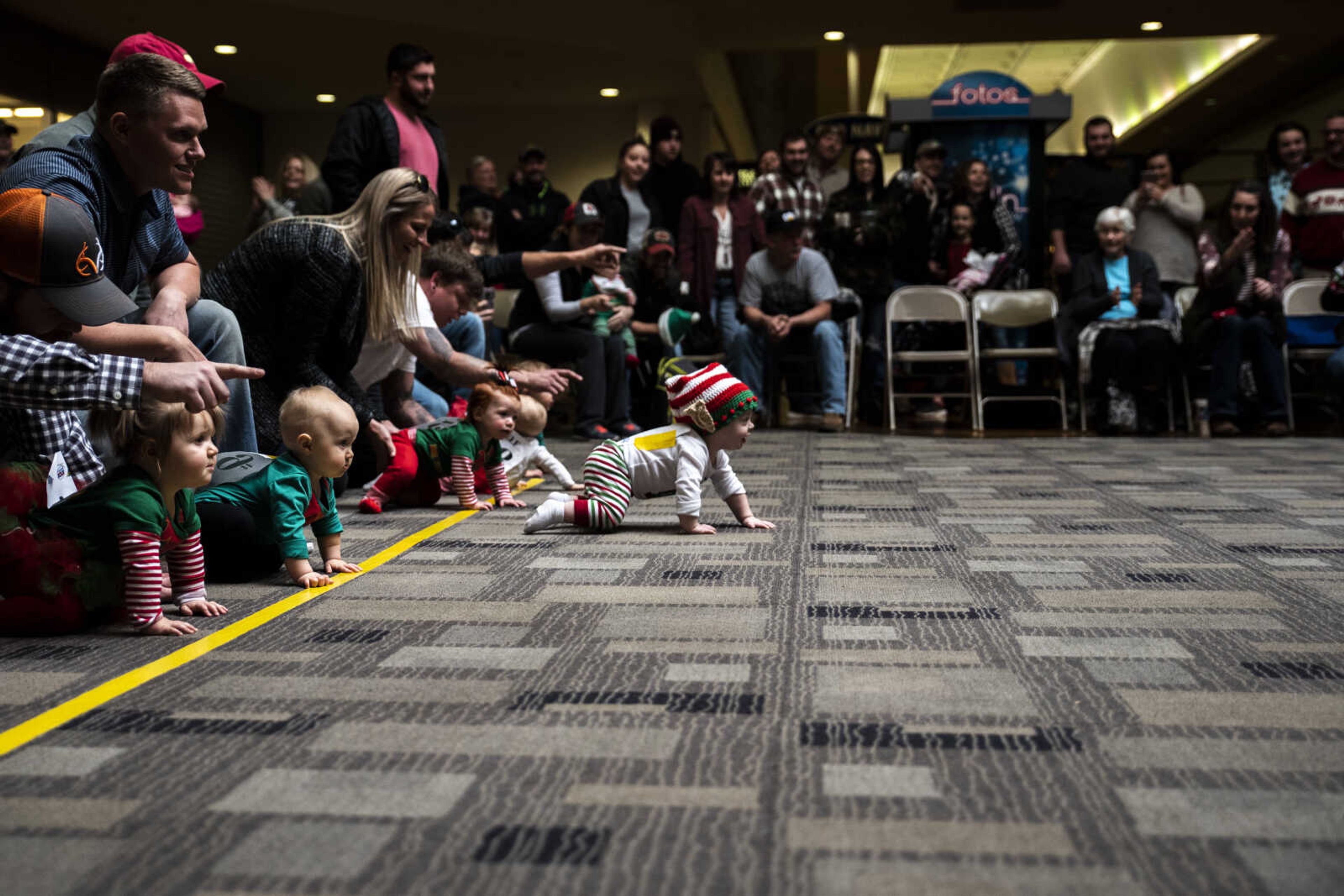 Babies stall at the start line at the start of the first heat of the Elf Races at West Park Mall Sunday, Dec. 9, 2018, in Cape Girardeau.