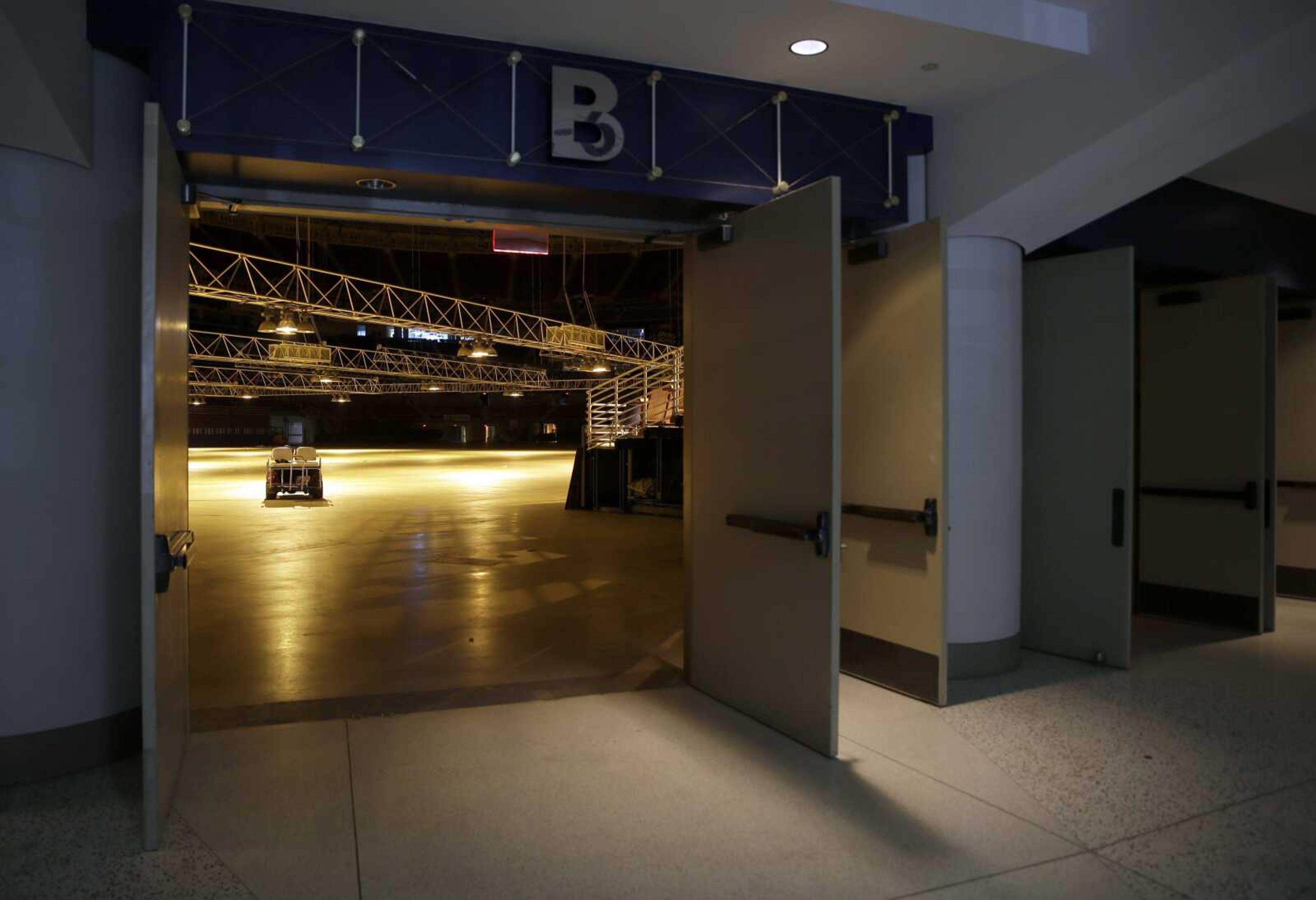 Open doors lead to the empty floor of the Edward Jones Dome, former home of the St. Louis Rams, on Wednesday in St. Louis. NFL owners voted Tuesday to allow the Rams to move from St. Louis to Los Angeles starting with the 2016 season. (Jeff Roberson ~ Associated Press)