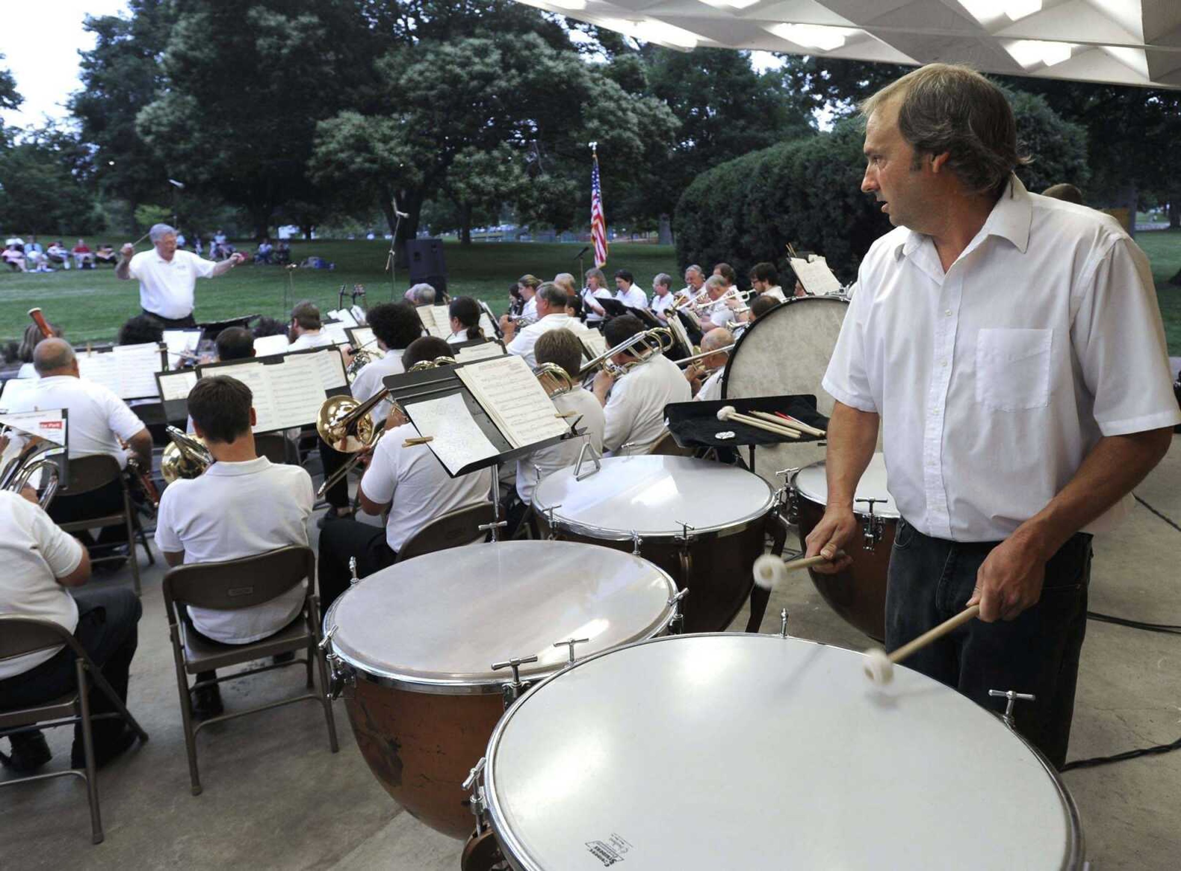 Mike Lamb plays tympani with the Cape Girardeau Municipal Band under the direction of Ronald Nall during its concert June 5, 2013, at the Capaha Park bandshell. (Fred Lynch)