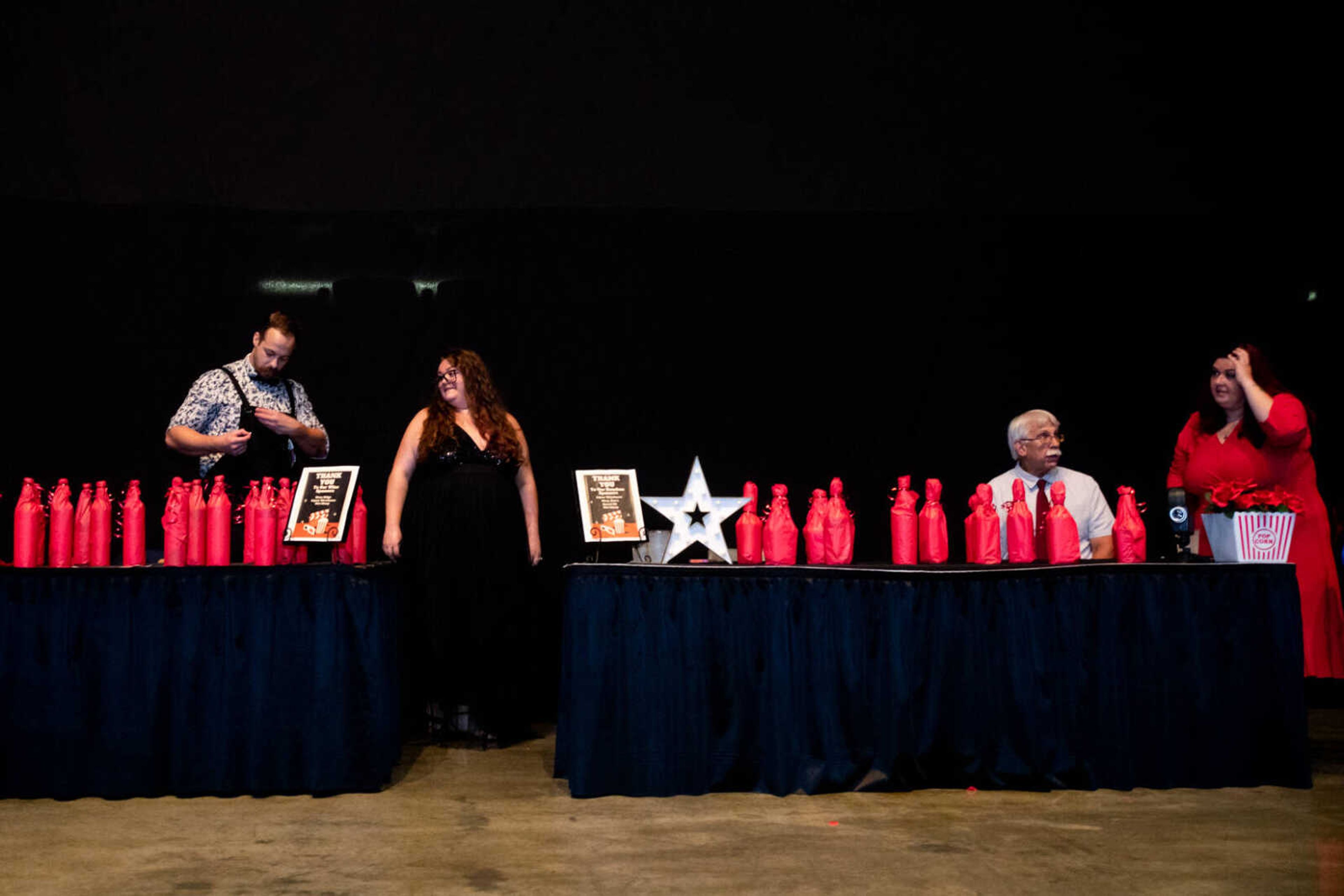 Zachary Reimer, Savannah Manetz, Don Harris and Ariese Patterson host the bourbon and wine raffles at&nbsp;the 2023 Dancing With Show Me Stars event on Saturday, July 29 at the Show Me Center.