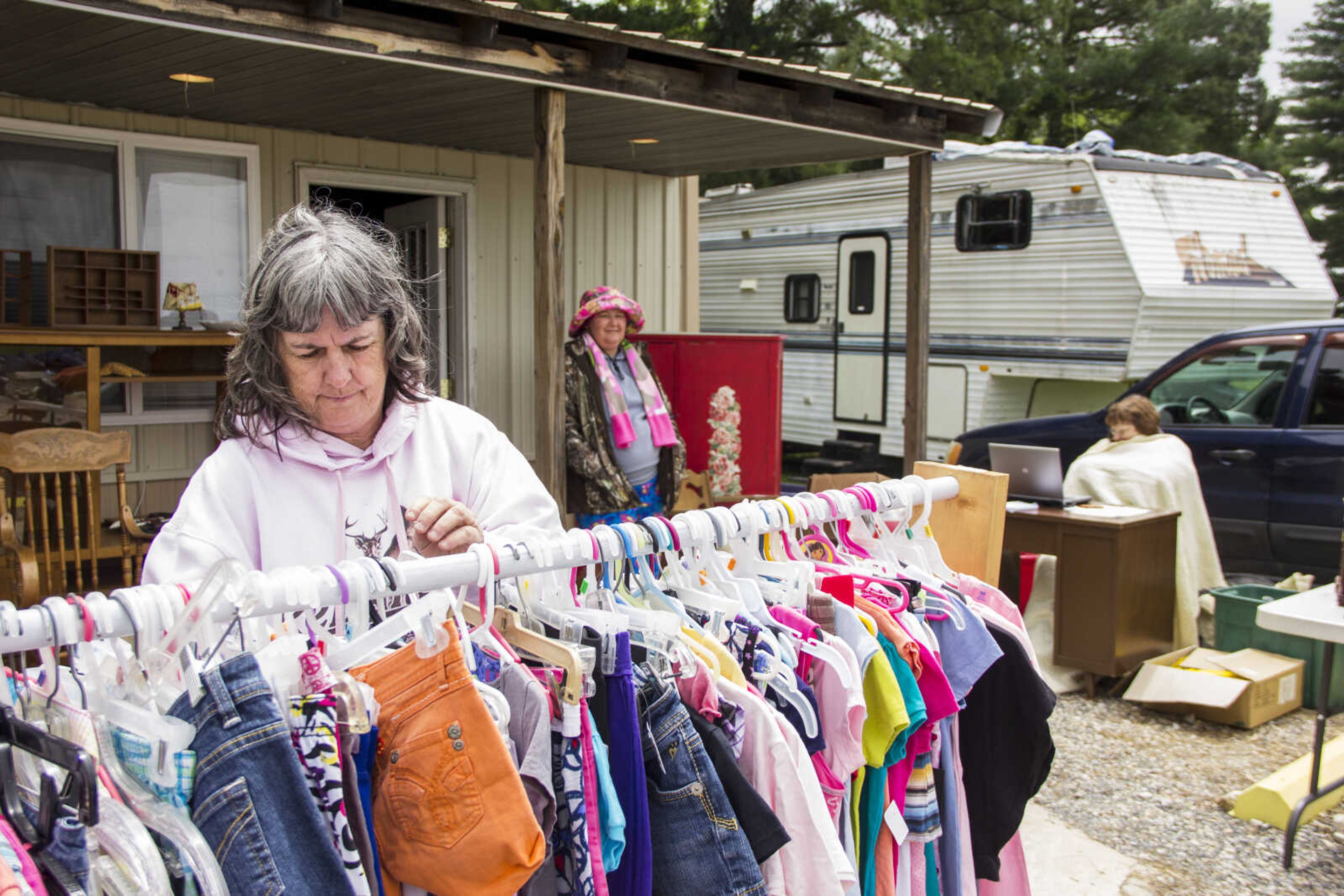 CAROL KELLISON ~ photo@semissourian.com

Lisa Griffin sorts through her sale items at the 100-mile yard sale Thursday May 22, 2015 in Advance, Missouri.