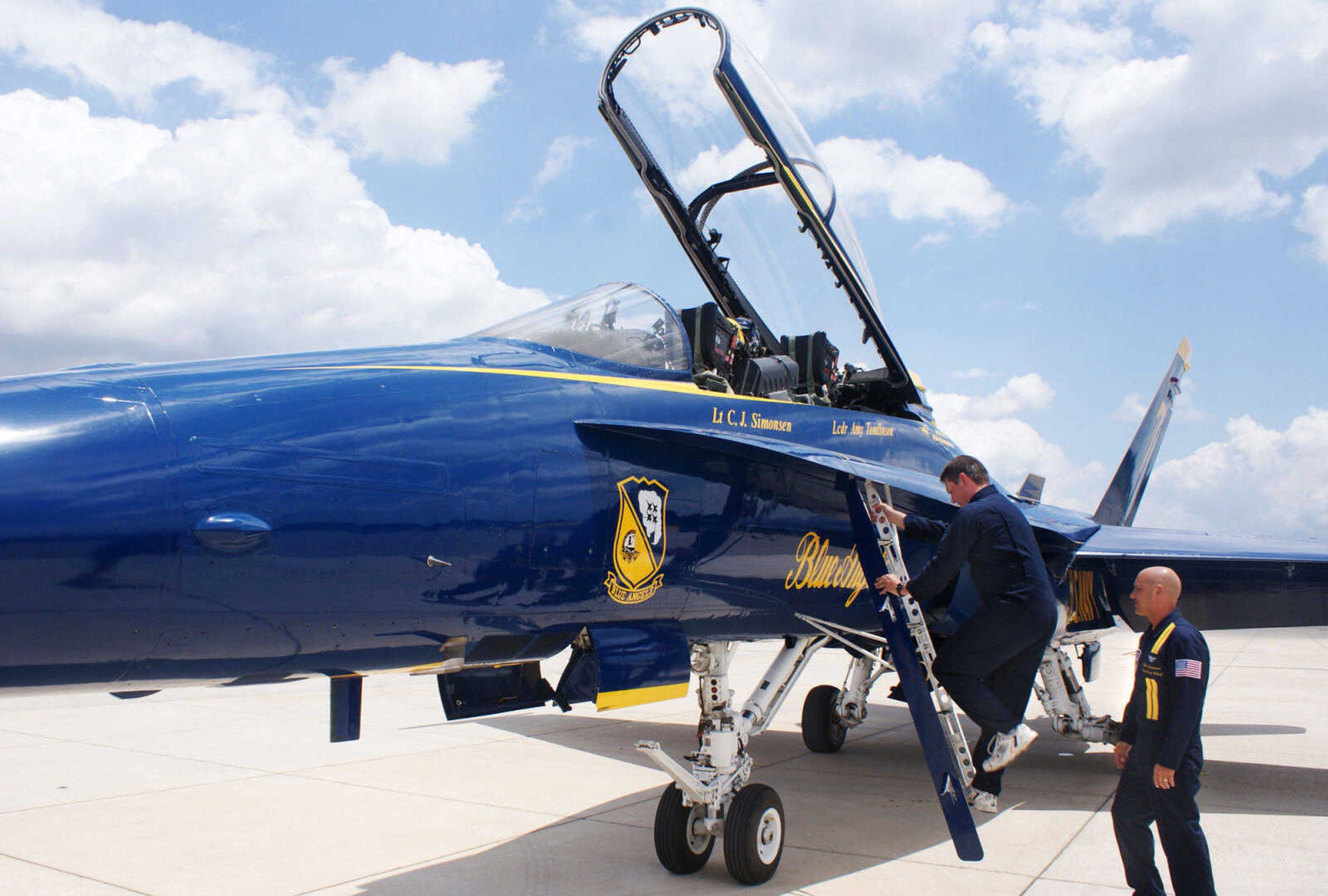 BAILEY REUTZEL ~ breutzel@semissourian.com

Rob Bunger climbs aboard the Blue Angels' F/A-18 plane as #7 Crew Chief Chad Swanson, bottom, stands by at the Cape Girardeau Airport on Wednesday, June 16, 2010. Bunger was one of three area people who got the chance to fly with the Blue Angels on Wednesday.