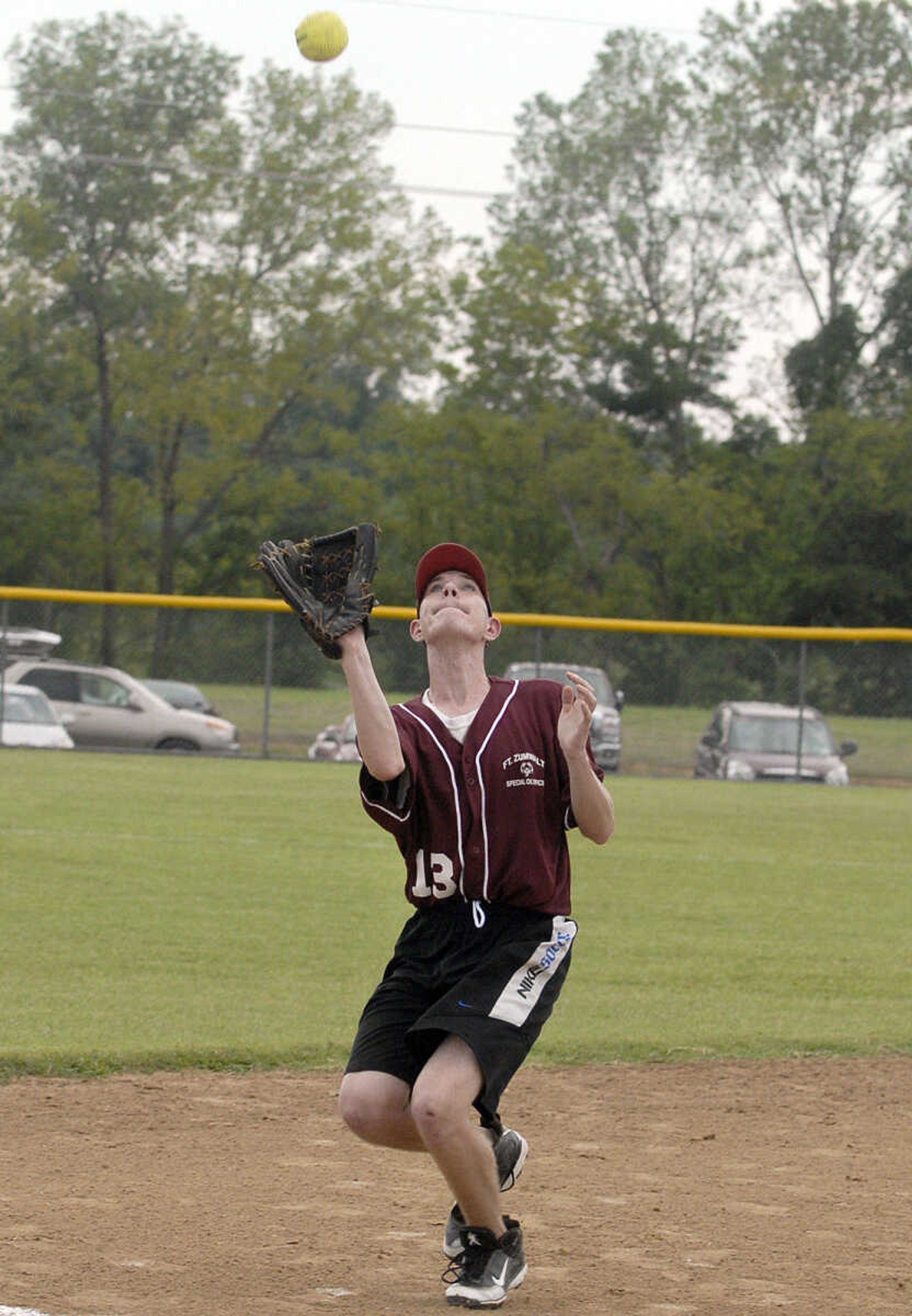 LAURA SIMON ~ lsimon@semissourian.com
Fort Zumwalt's third baseman gets under a pop up Saturday, August 13, 2011 during the Special Olympics State Outdoor Championship at Shawnee Sports Complex in Cape Girardeau.