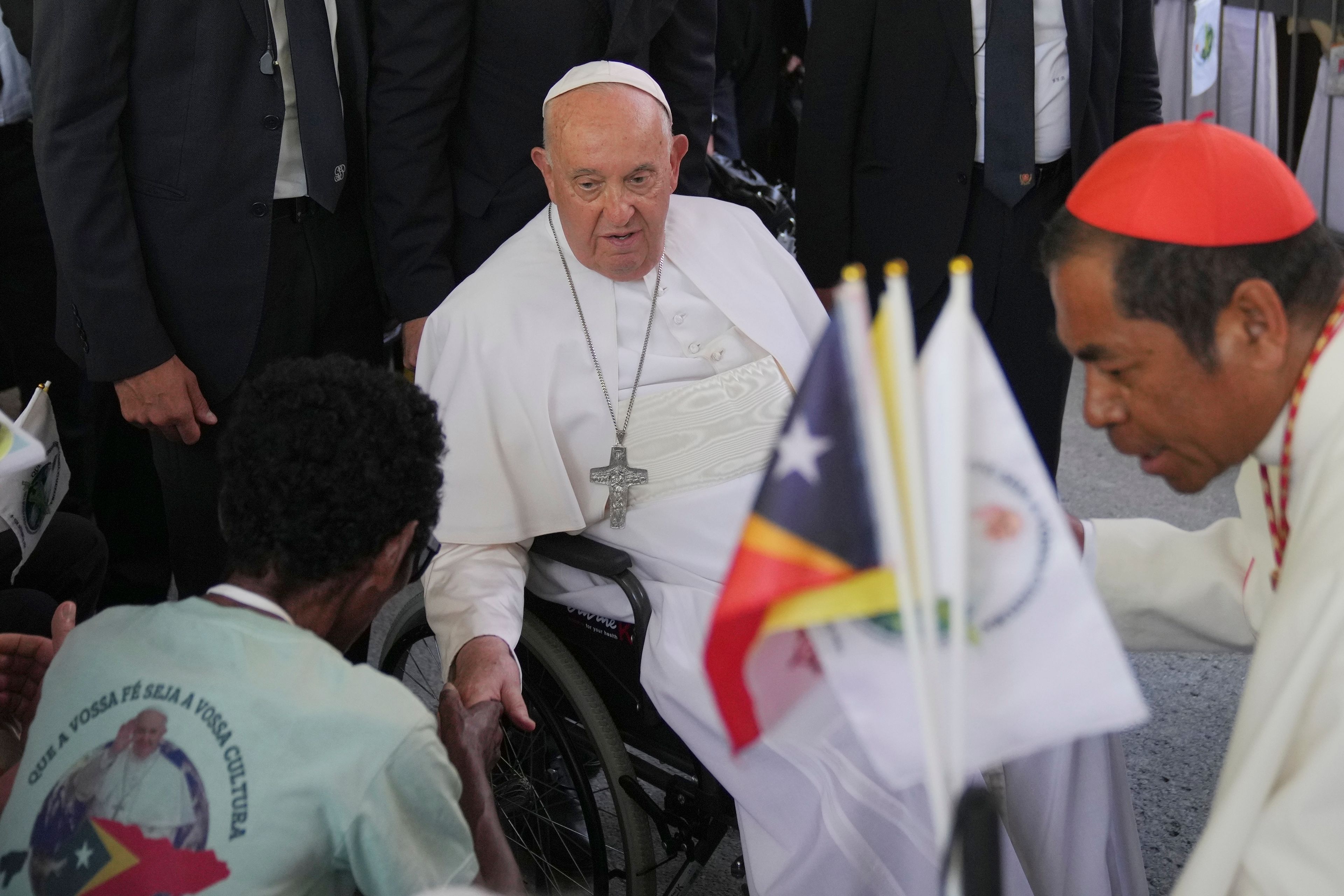 Pope Francis greets the people after the holy mass at the Cathedral of the Immaculate Conception in Dili, East Timor, Tuesday, Sept. 10, 2024. (AP Photo/Dita Alangkara)