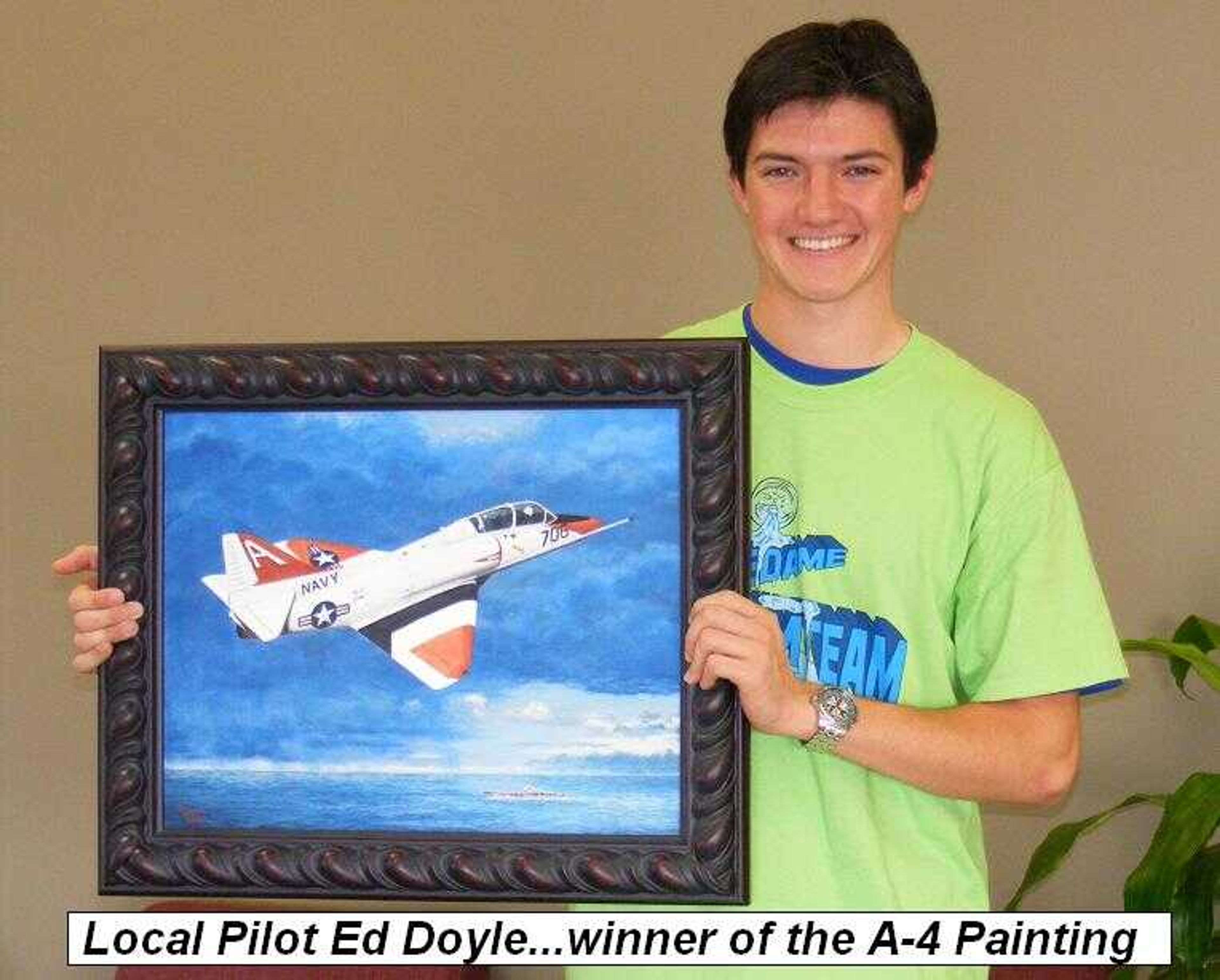 Ed Doyle, winner of the A-4 oil painting by Mary Russell