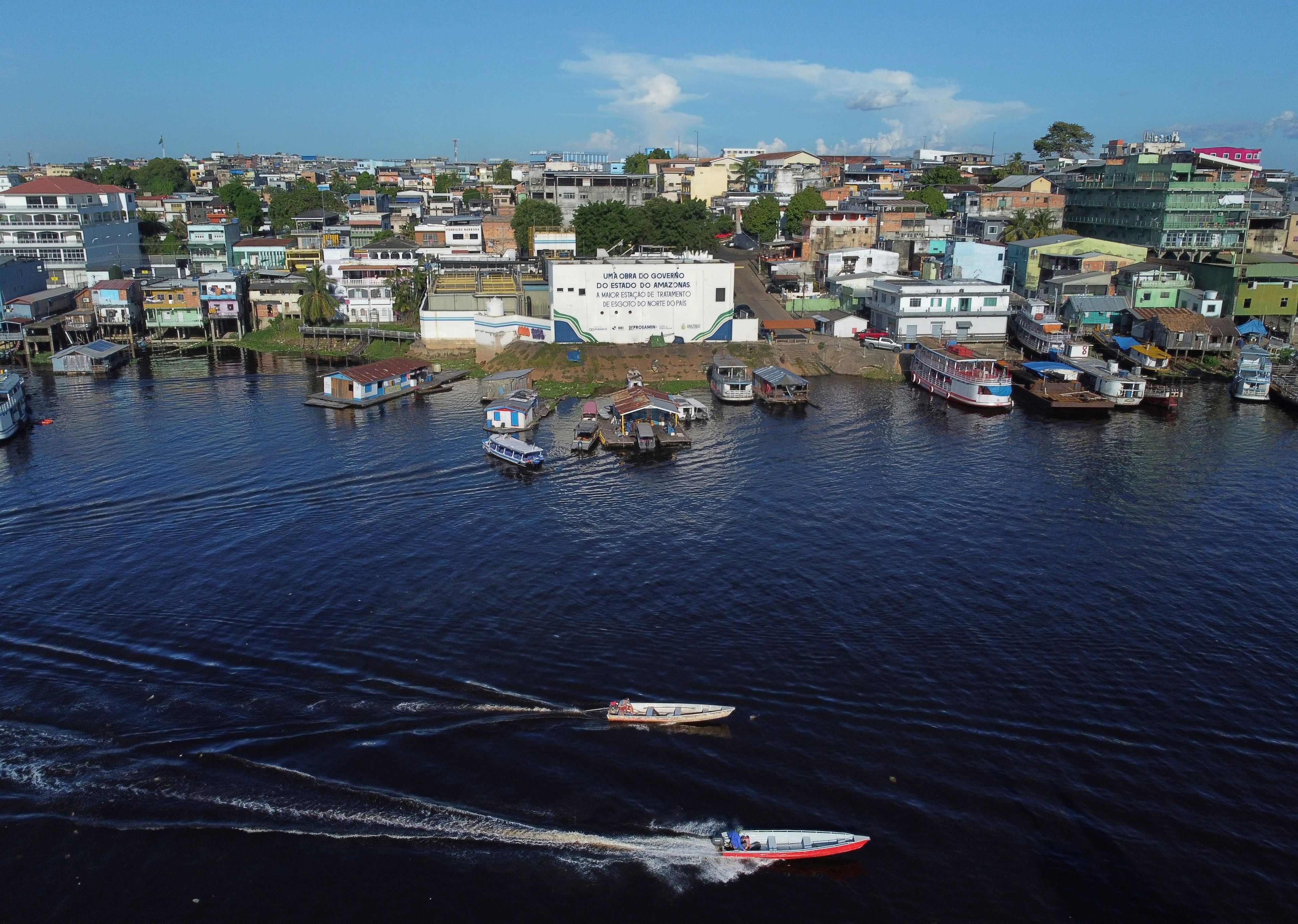 Part of the Educandos that connects to the Negro River is visible in Manaus, state of Amazonas, Brazil, Tuesday, June 17, 2024. (AP Photo/Edmar Barros)