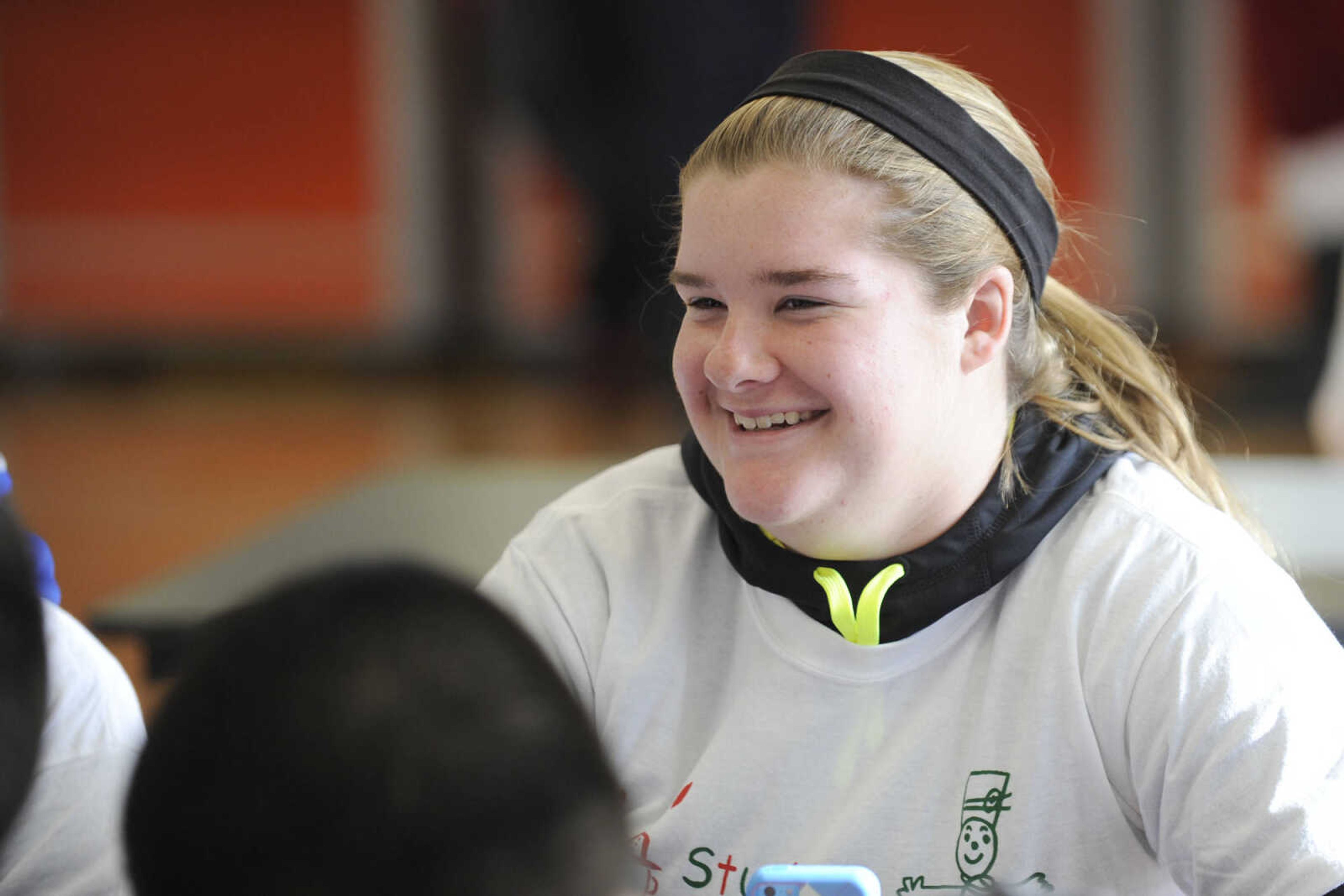 GLENN LANDBERG ~ glandberg@semissourian.com

Sarah Kitchen laughs with fellow volunteers during the Student Santas Christmas dinner Thursday, Dec. 25, 2014 at Central Junior High School.