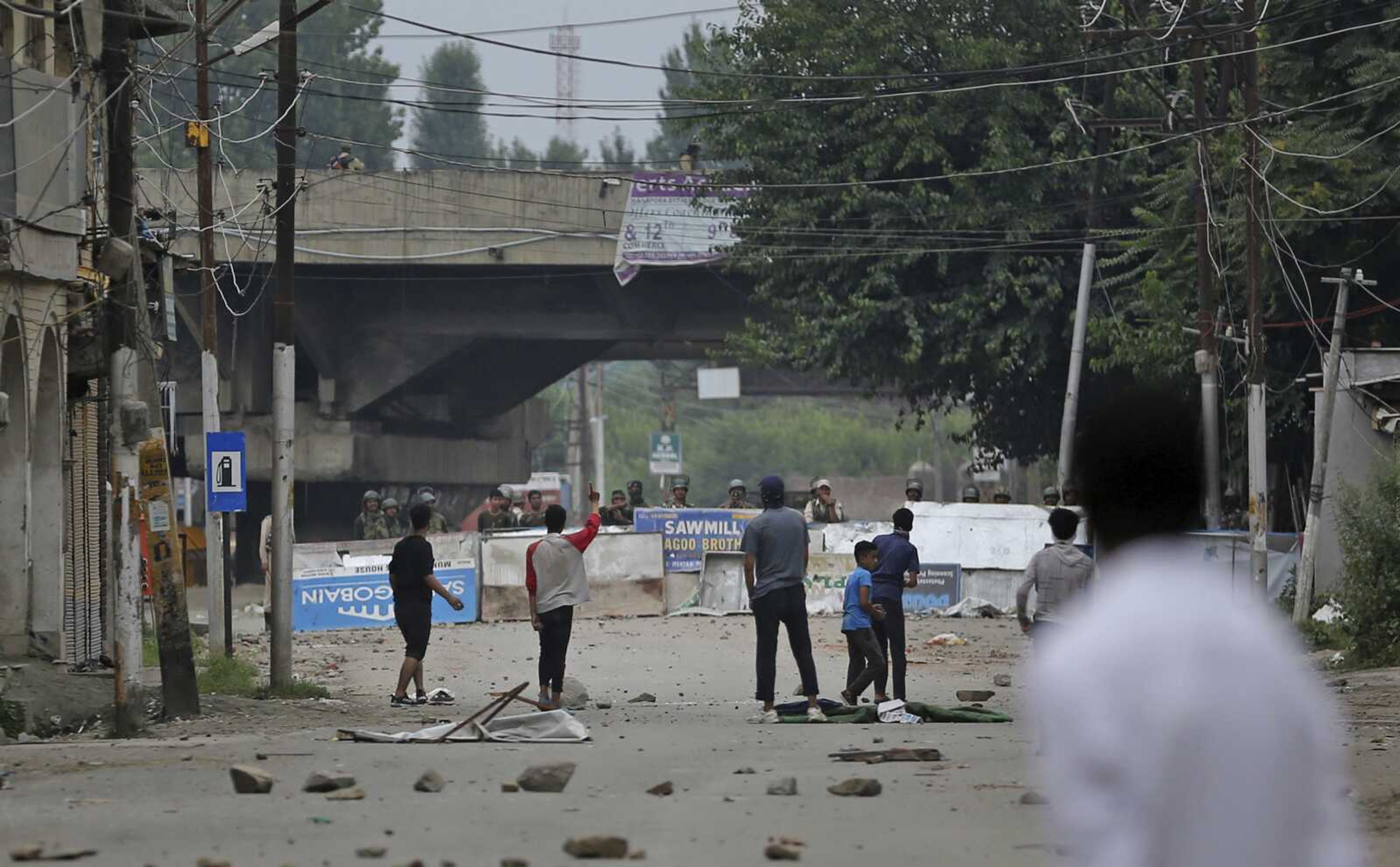 Kashmiri protesters challenge paramilitary soldiers during a protest Friday against the Indian government in Srinagar, India.