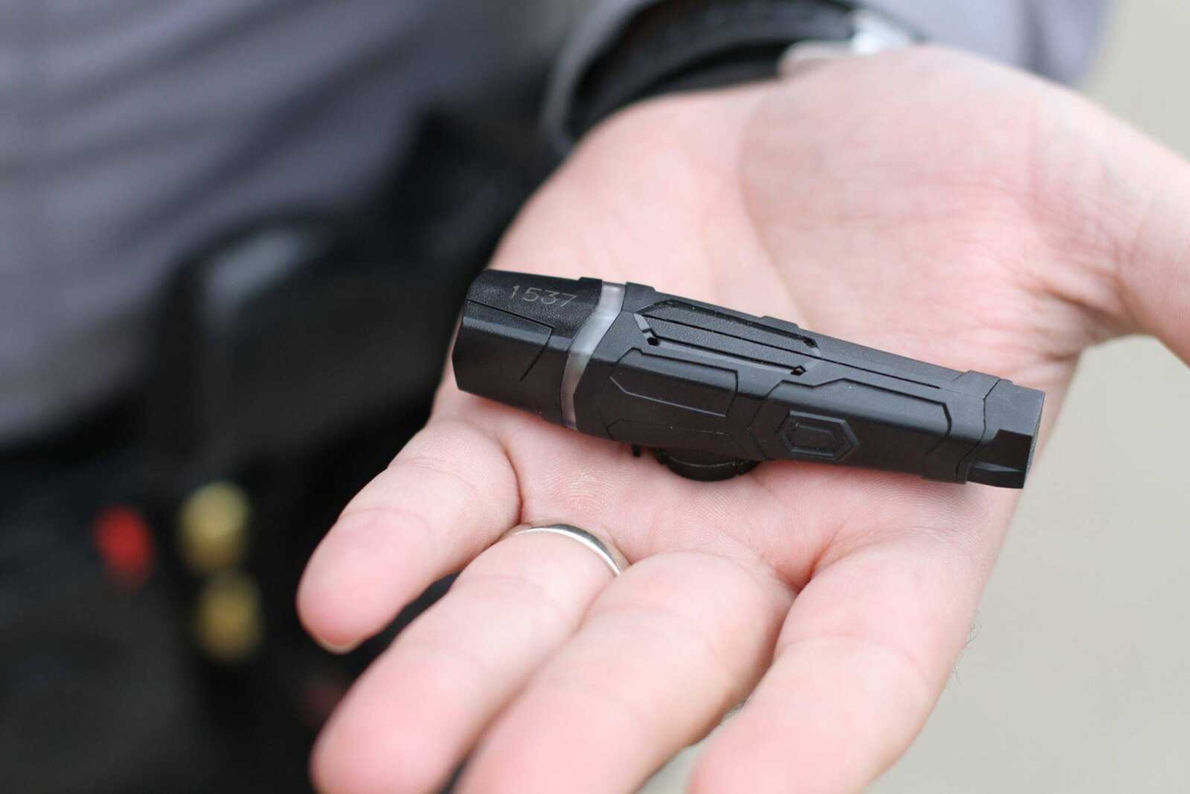 Senior Deputy Matt Scroggins with the Scott County Sherif's Department demonstrates the Taser AXON Flex body camera unit Friday, March 20, 2015. (Glenn Landberg)