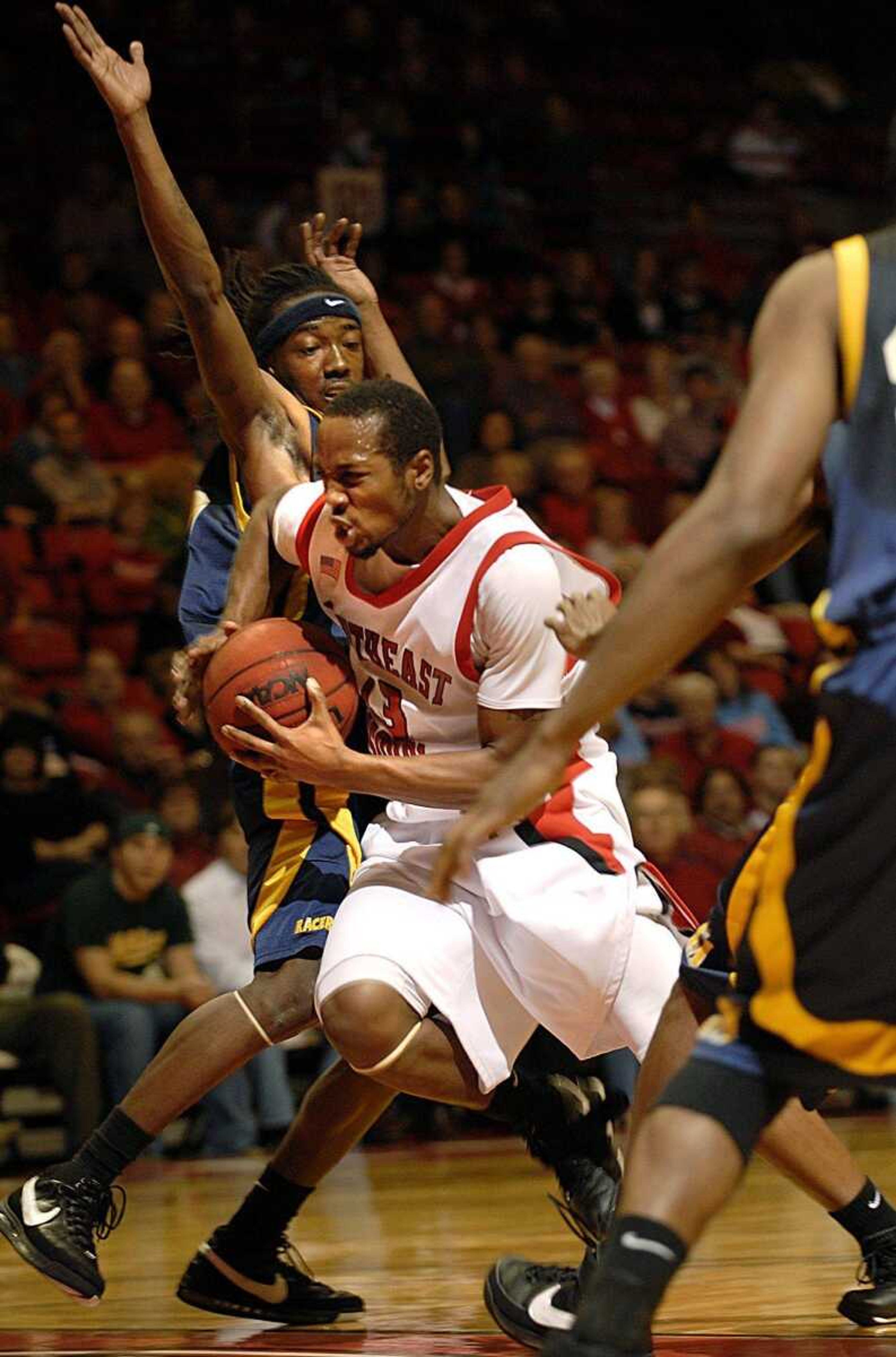 Southeast Missouri State's Roderick Pearson drove past Murray State's Kevin Thomas during the first half Monday at the Show Me Center. (Aaron Eisenhauer)