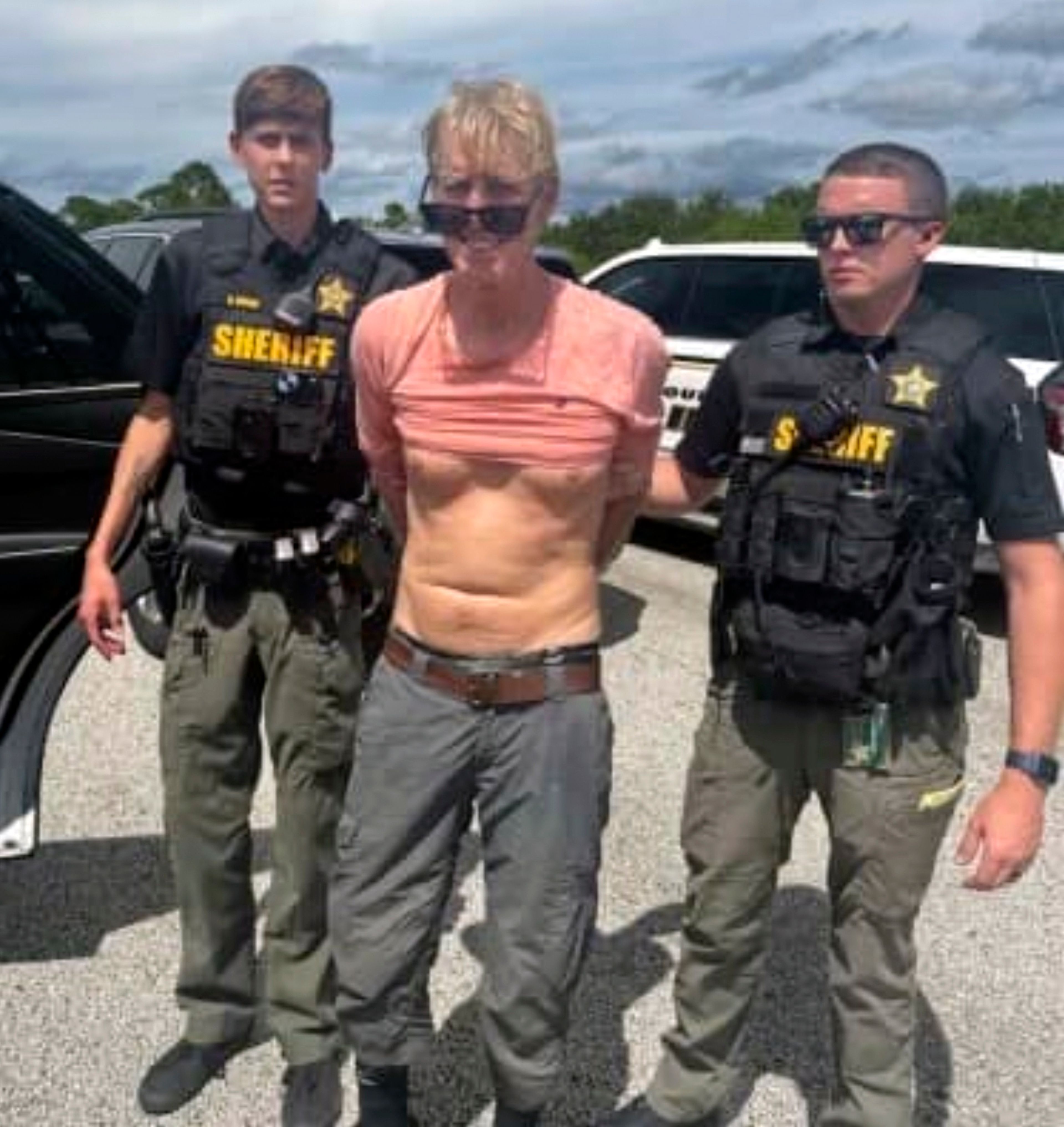 In this imaged released by the Martin County, Fla., Sheriff’s Office, law enforcement officers arrest Ryan Routh, the man suspected in the apparent assassination attempt of Donald Trump, Sunday, Sept. 15, 2024. (Martin County Sheriff’s Office via AP)