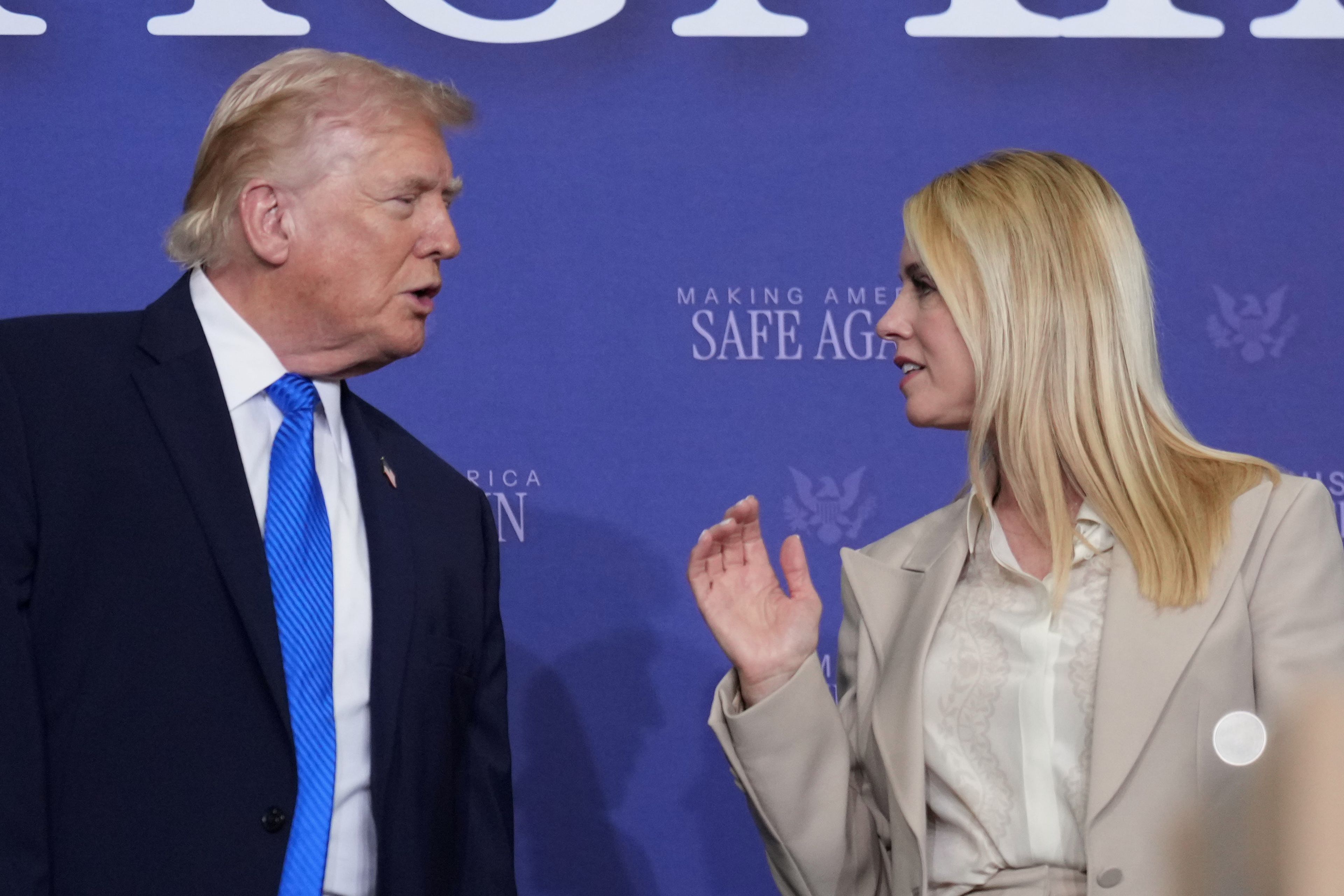 President Donald Trump speaks with Attorney General Pam Bondi during a roundtable discussion on public safety at a Tennessee Air National Guard Base, Monday, March 23, 2026, in Memphis, Tenn. (AP Photo/Mark Schiefelbein)