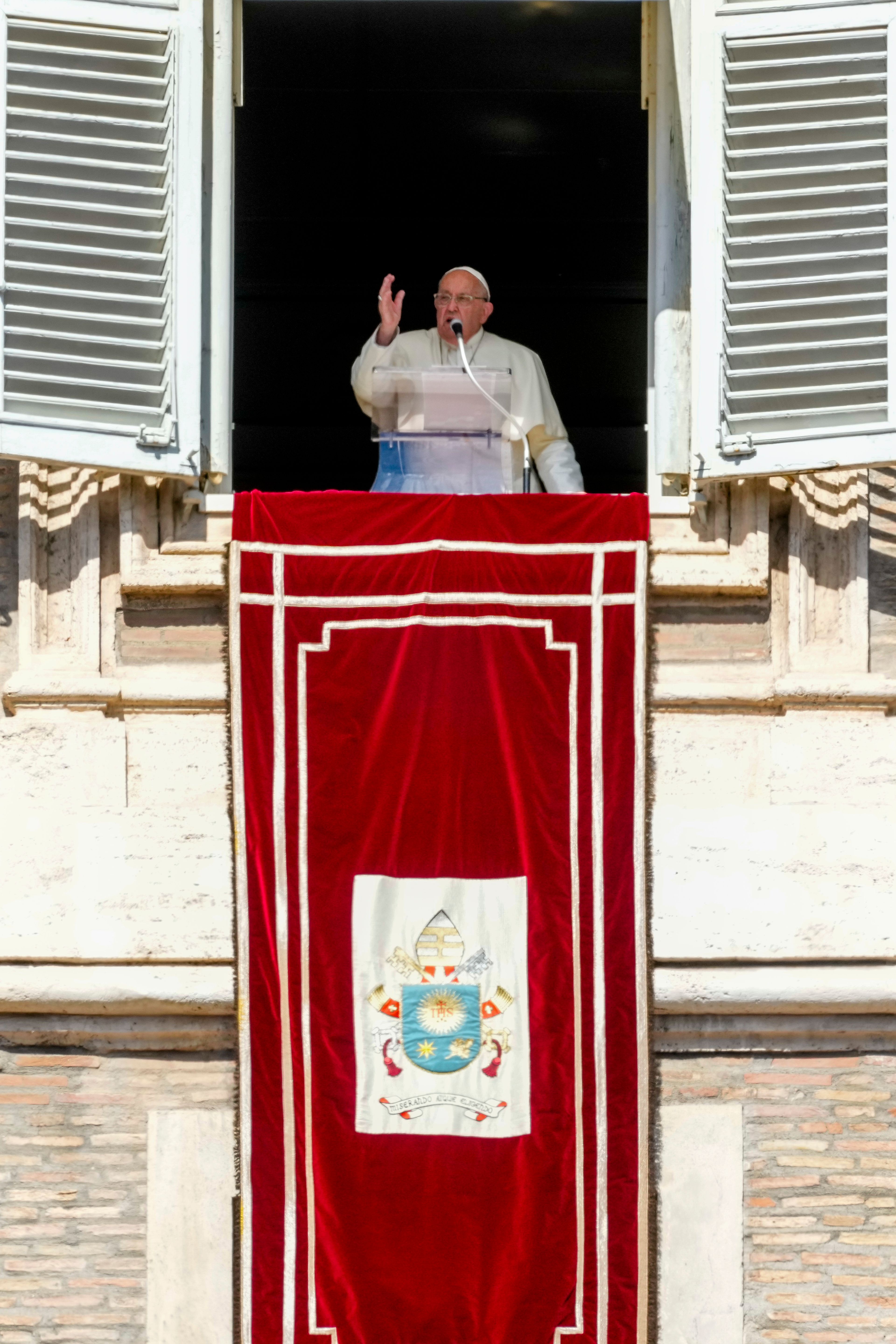 Pope Francis appears at his studio window for the traditional noon blessing of faithful and pilgrims gathered in St. Peter's Square at The Vatican, Sunday, Oct. 6, 2024. (AP Photo/Andrew Medichini)