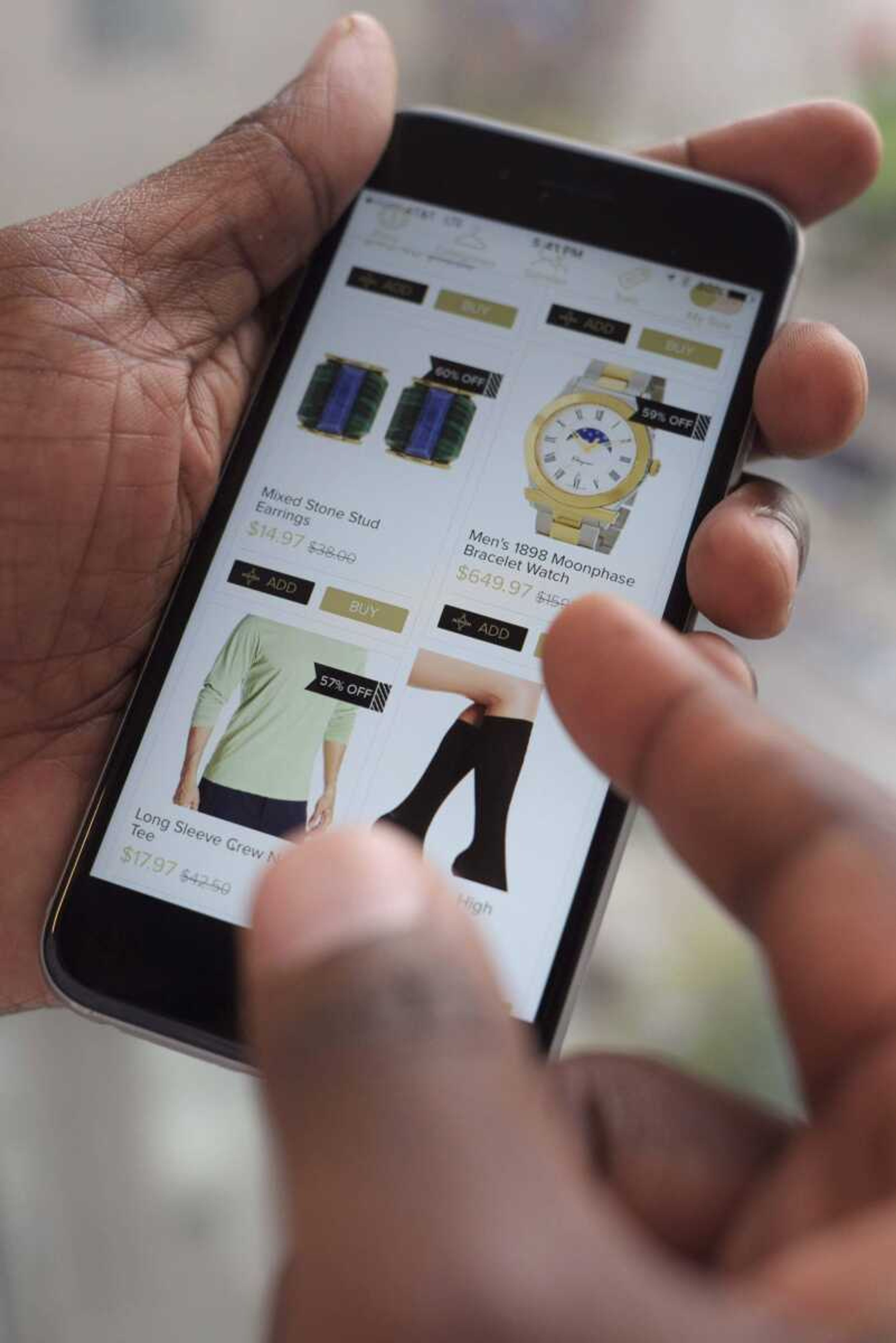 Discounted merchandise is displayed on a smartphone using the Hafta Have app in New York.