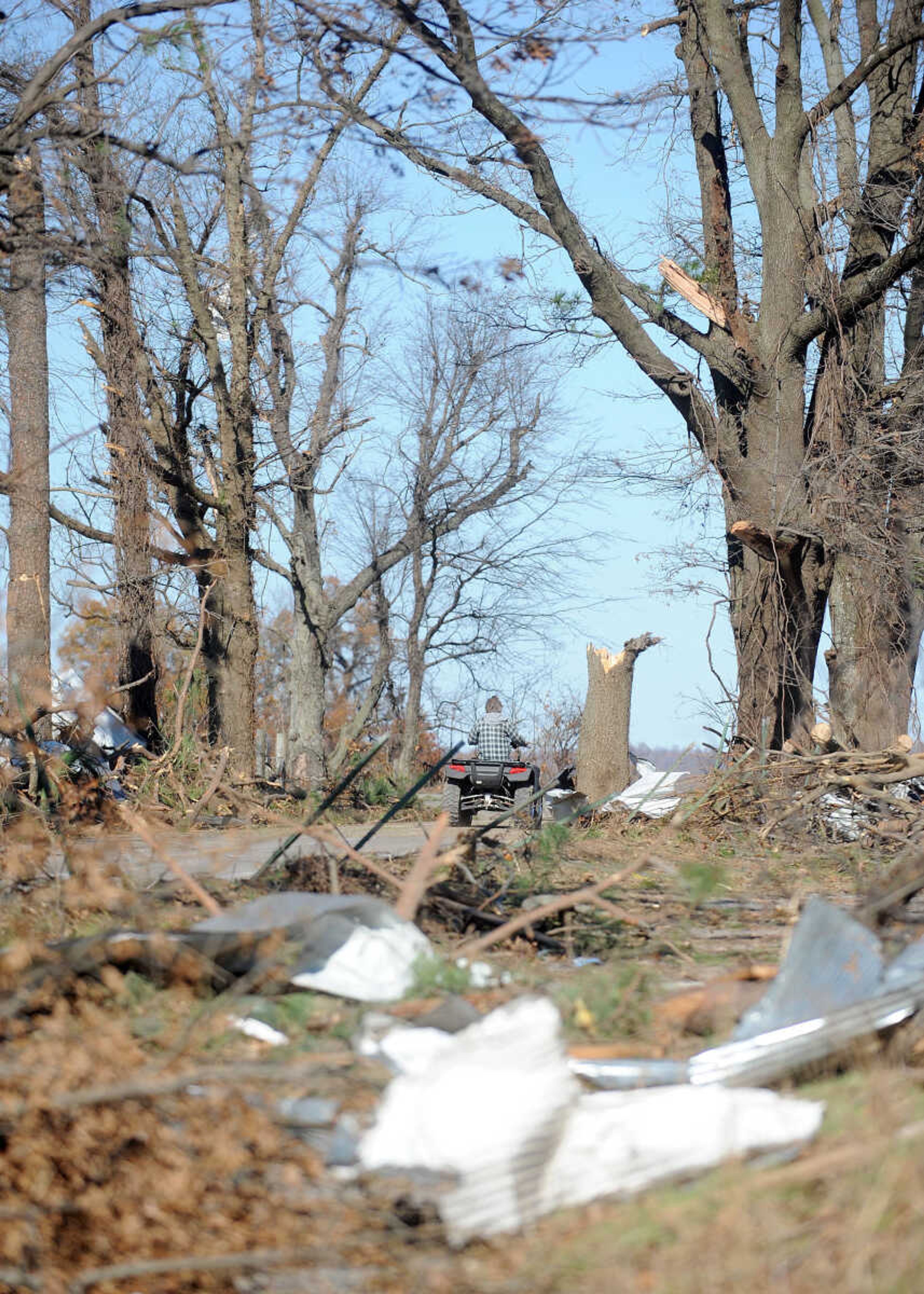 LAURA SIMON ~ lsimon@semissourian.com

A man on a four-wheeler cruises past debris left behind at Vince Draper's cattle farm from Sunday's storm, Monday, Nov. 18, 2013, southeast of Morley, Mo.