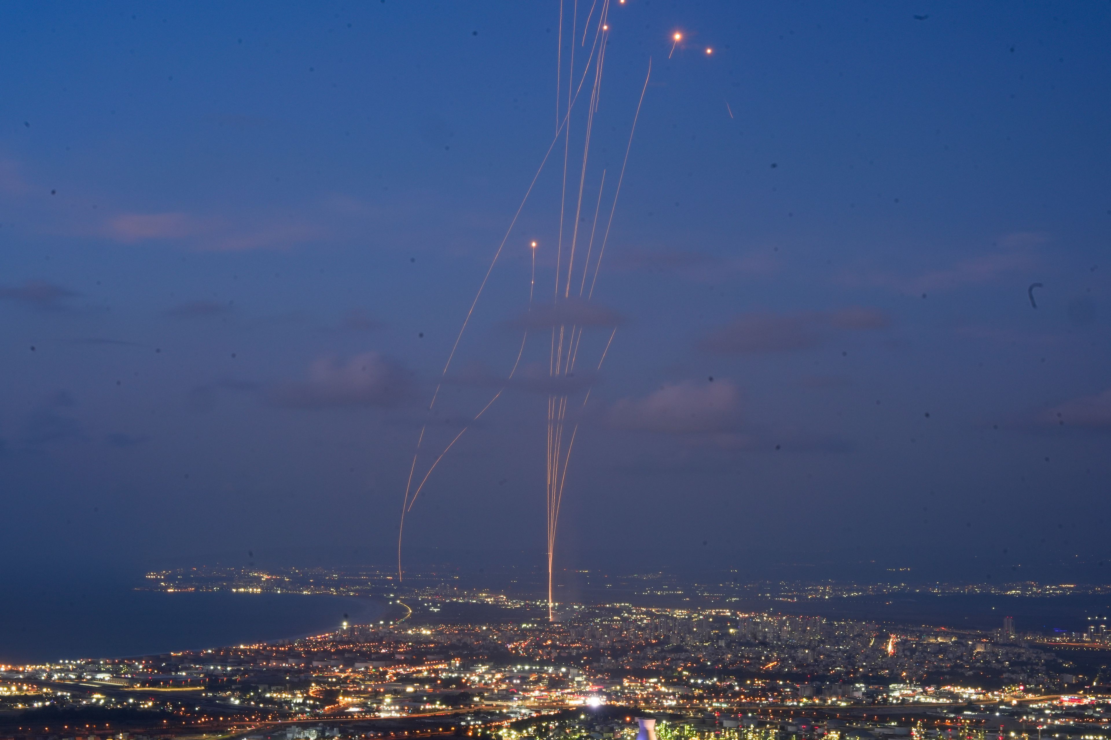 FILE - Israeli Iron Dome air defense system fires to intercept rockets that were launched from Lebanon, as seen from Haifa, northern Israel, Monday, Sept. 23, 2024. (AP Photo/Baz Ratner, File)