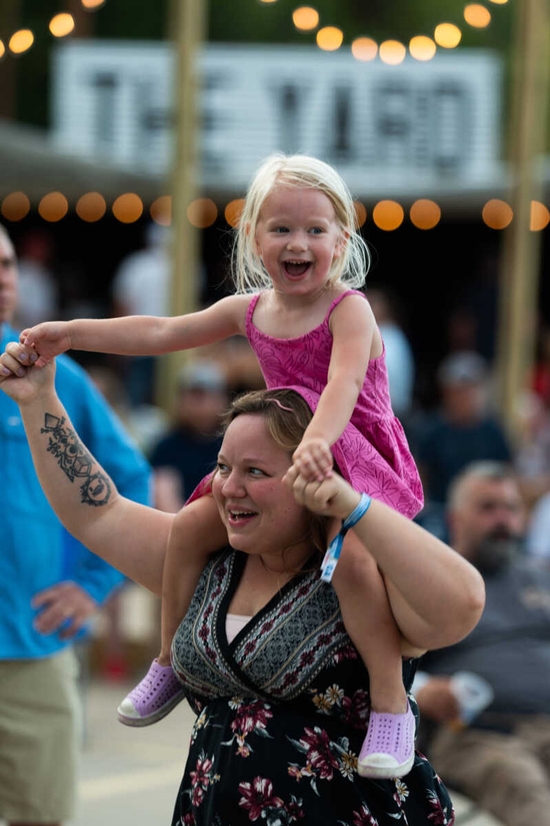 Attendees dance at Shipyard Music Festival 2022. Kids 10 and under get free admission with a ticketed adult.