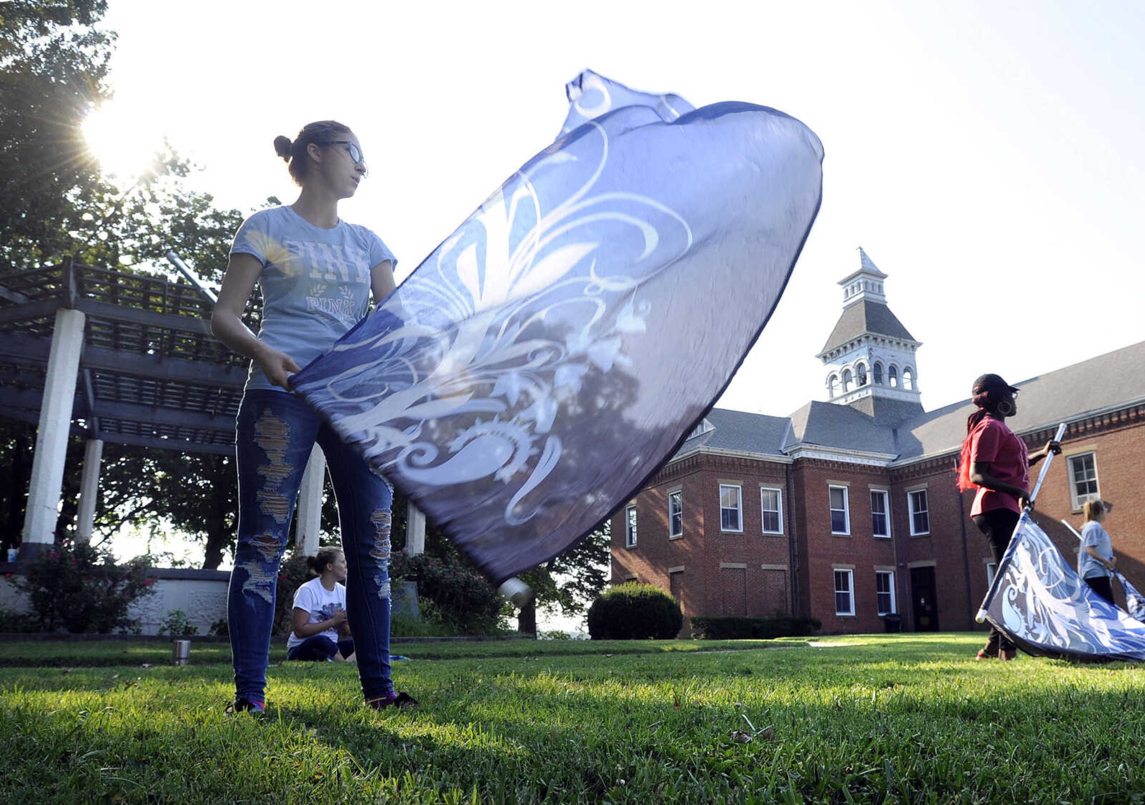 FRED LYNCH ~ flynch@semissourian.com
Abbie Wilmarth practices a routine Tuesday, July 24, 2018 with members of the Marching Tigers color guard of Cape Girardeau Central High School at Ivers Square in Cape Girardeau.