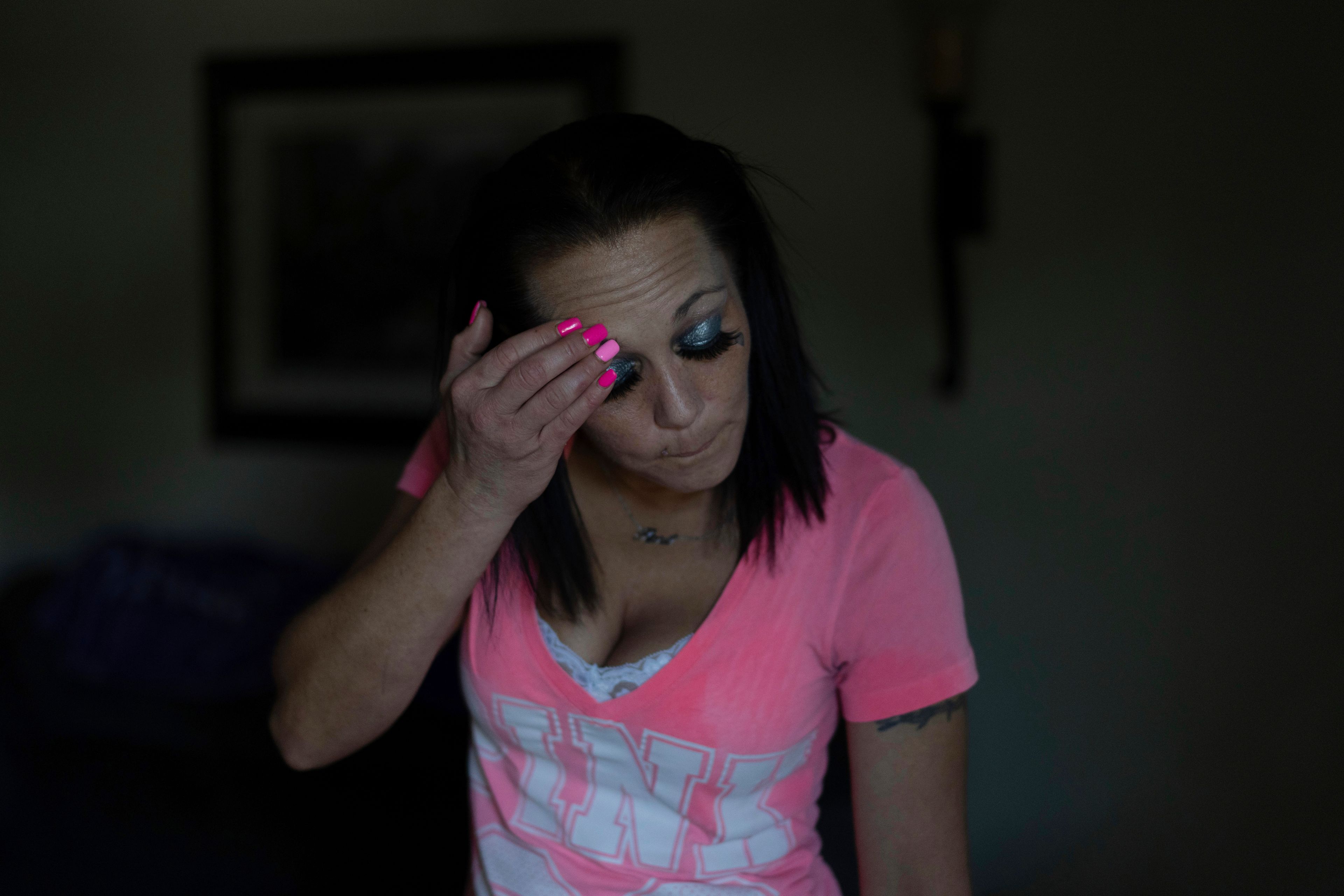 April Youst pauses in her living room in West Virginia on Wednesday, Oct. 9, 2024. (AP Photo/Carolyn Kaster)