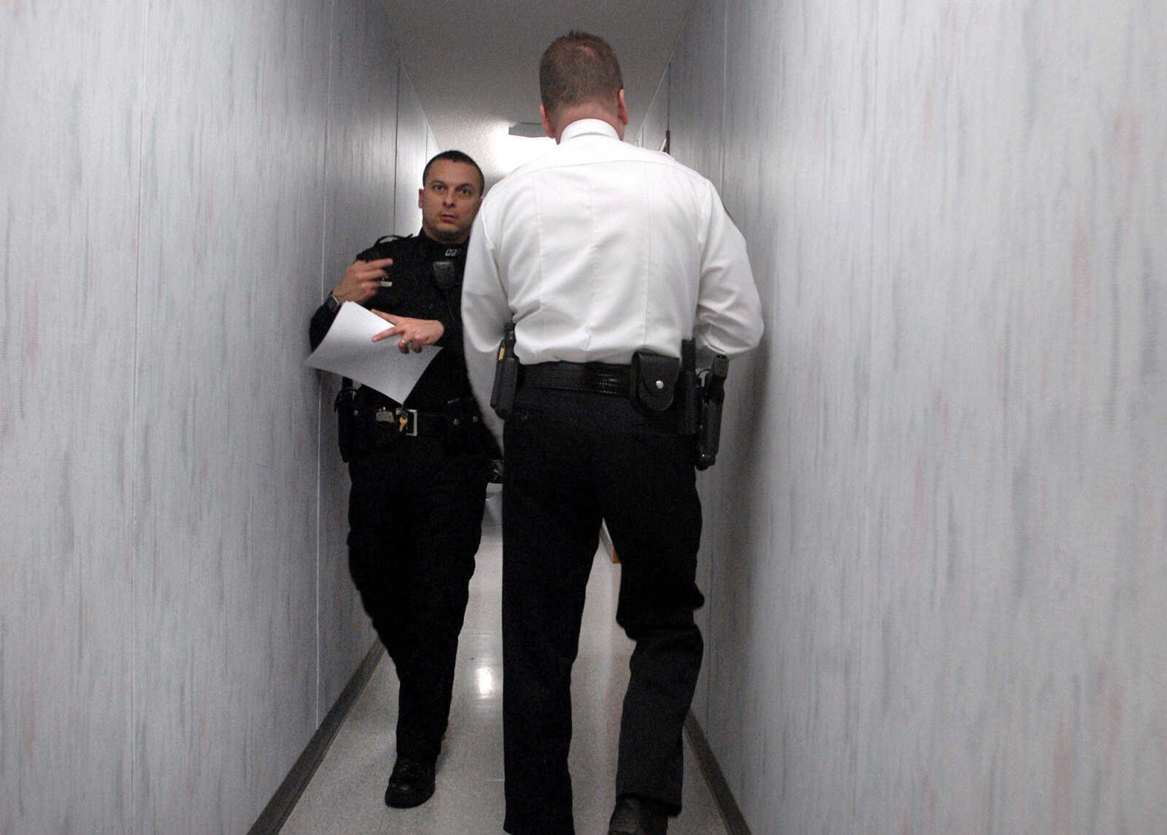 LAURA SIMON ~ lsimon@semissourian.com
Officers squeeze through the narrow hallway Friday, February 10, 2012 inside the modular unit that houses 22 members of the Cape Girardeau Police Department staff.