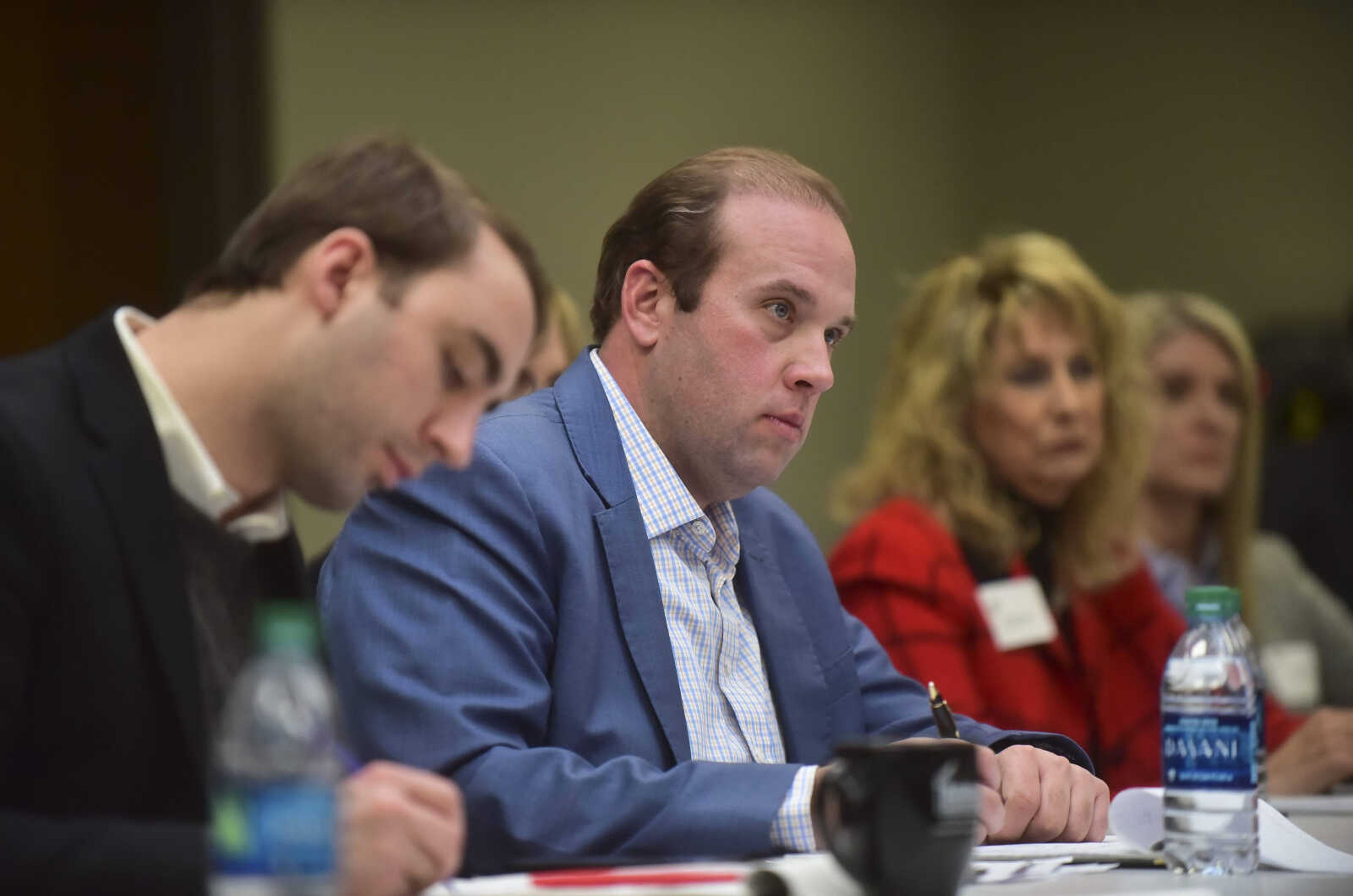 U.S. Rep. Jason Smith of the 8th Congressional District listens during a roundtable discussion with area health-care professionals at the Cape Girardeau Area Chamber of Commerce conference room in Marquette Tower building Wednesday in Cape Girardeau.