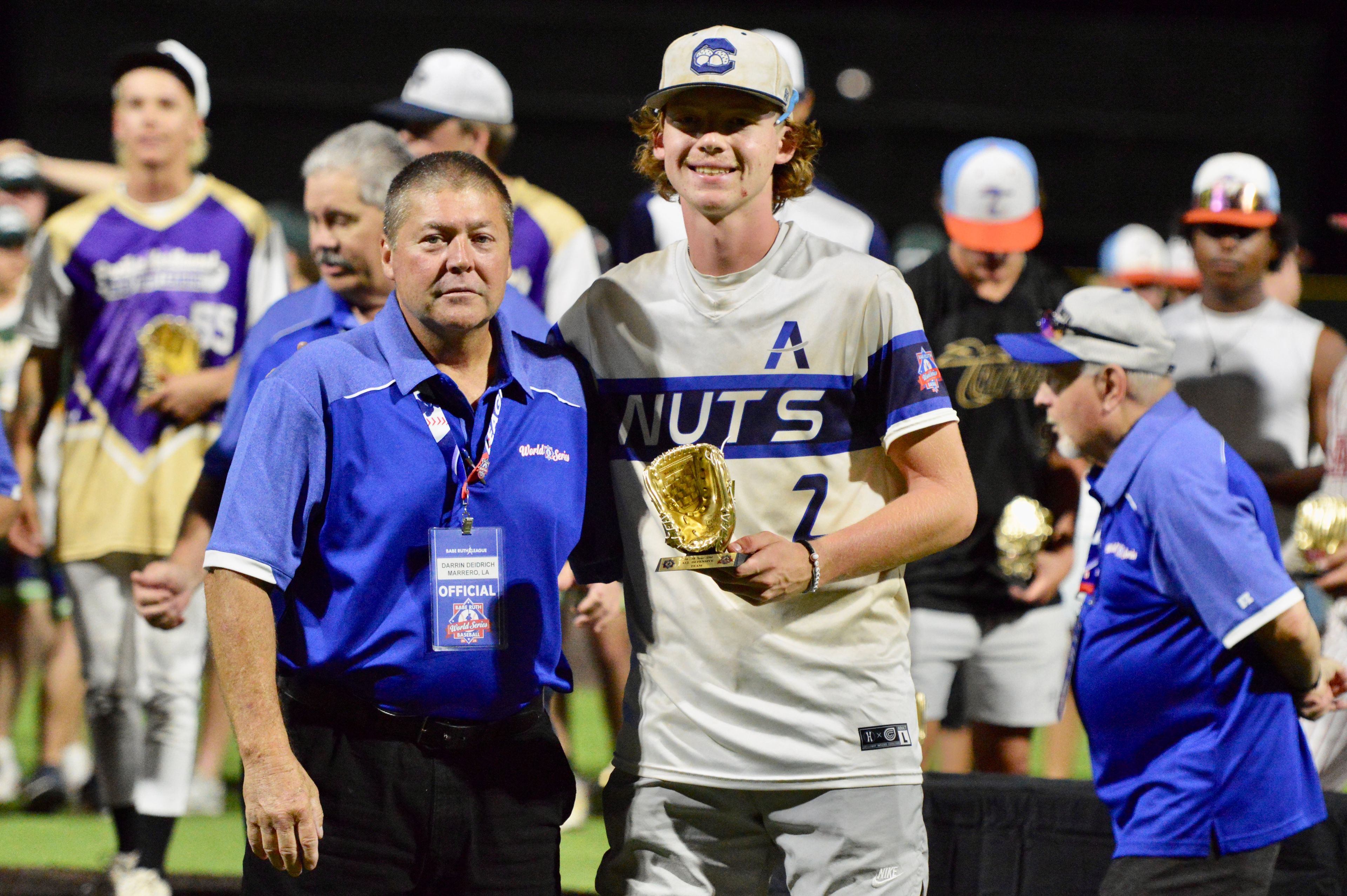 Charleston Fighting Squirrels‘ Owen Willis is handed and all-star trophy at the Babe Ruth World Series on Thursday, Aug. 15, at Capaha Field in Cape Girardeau, Mo. 