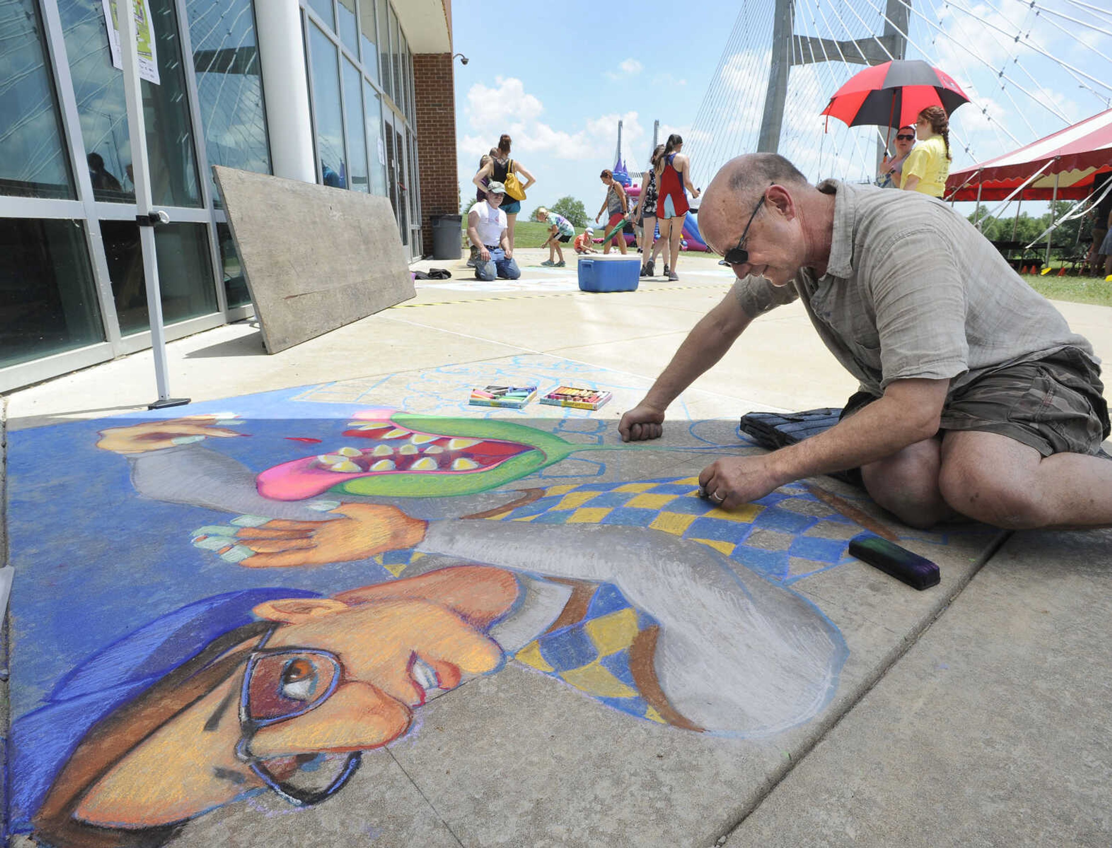 FRED LYNCH ~ flynch@semissourian.com
Craig Thomas creates chalk art depicting "Little Shop of Horrors" on Saturday, June 16, 2018 at the Summer Arts Festival at the River Campus.