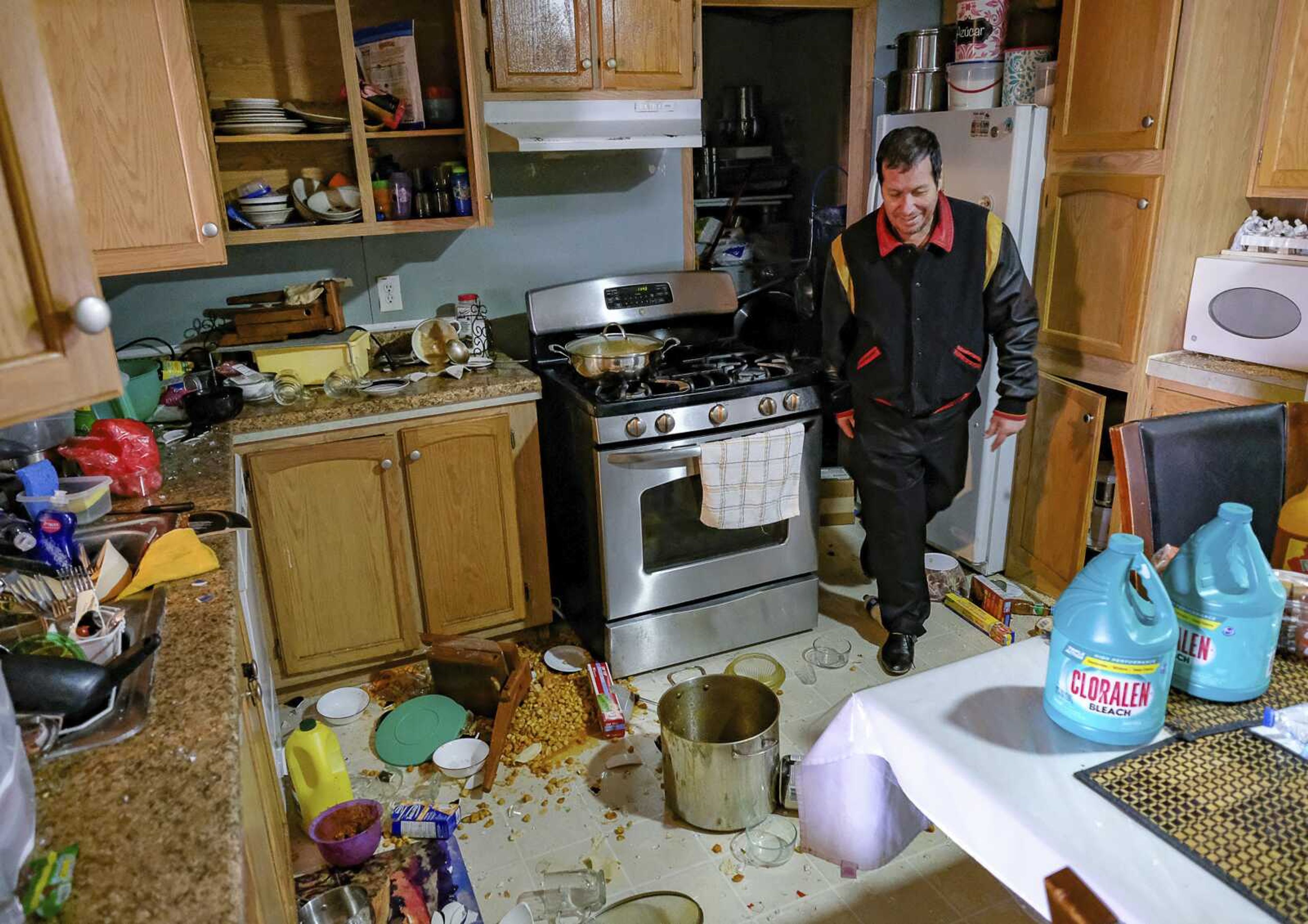 Roberto Duran points walks through the damage to his mobile home in Magna, Utah, after an earthquake that hit the area, Wednesday, March 18, 2020. (Francisco Kjolseth/The Salt Lake Tribune via AP)