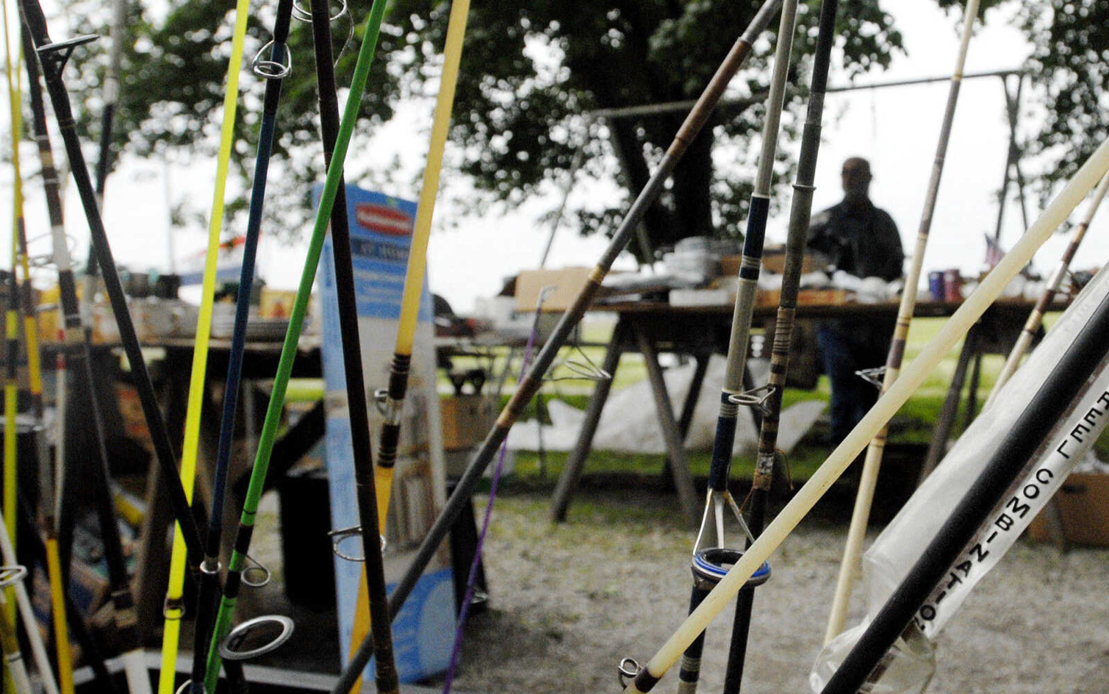 LAURA SIMON~lsimon@semissourian.com
Fishing poles wait to be purchased Friday, May 27, 2011 in Dutchtown during the 100-Mile Yard sale.