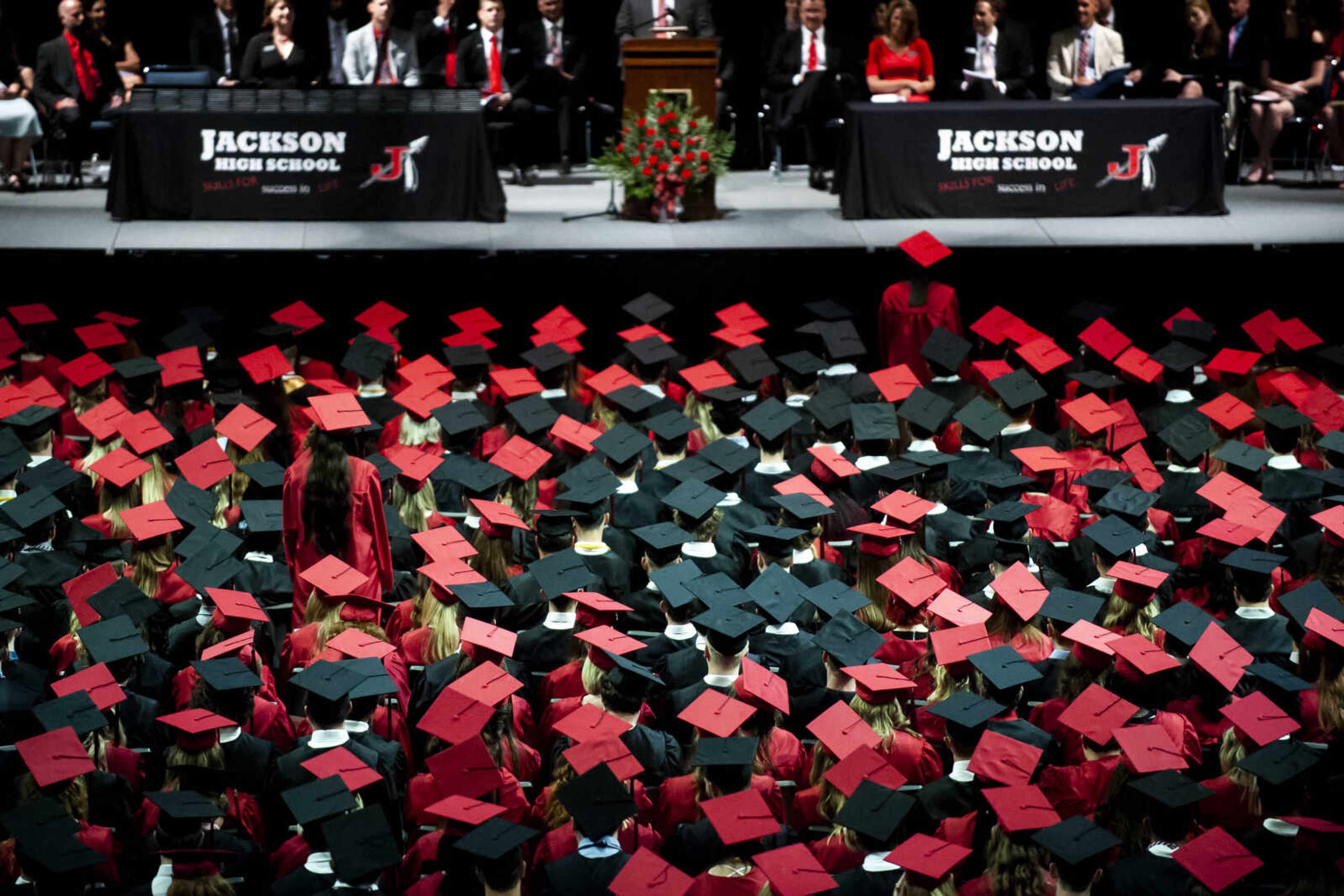 Graduates sit and listen as two of their classmates are recognized for their perfect and near-perfect attendance records during their high school career during the Jackson High School Class of 2019 Commencement at the Show Me Center Friday, May 24, 2019, in Cape Girardeau.