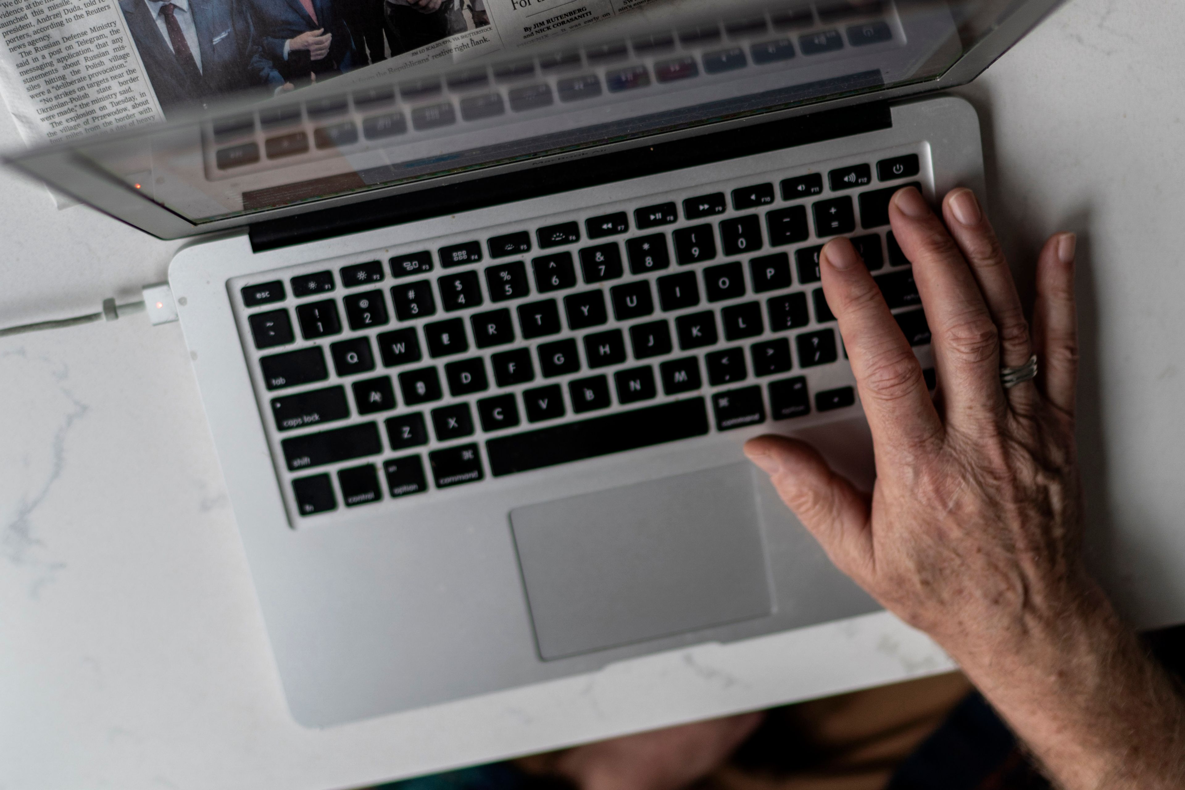 FILE - A person works on a laptop computer in Hudson, Wis., Nov. 16, 2022. (AP Photo/David Goldman, File)