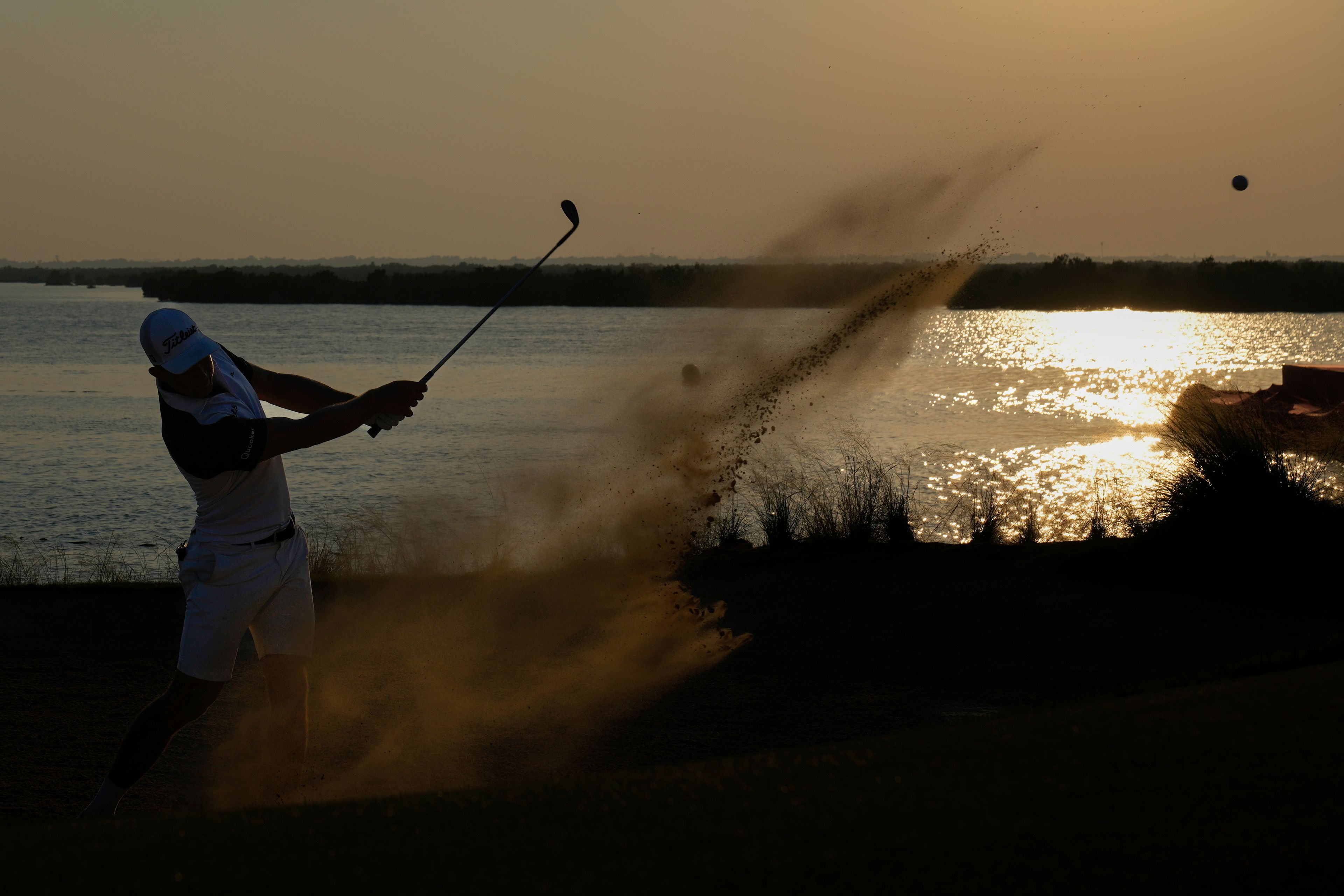 Niklas Hojgaard of Denmark plays his third shot on the 18th hole during the third round of Abu Dhabi Golf Championship in Abu Dhabi, United Arab Emirates, Saturday, Nov. 9, 2024. (AP Photo/Altaf Qadri)