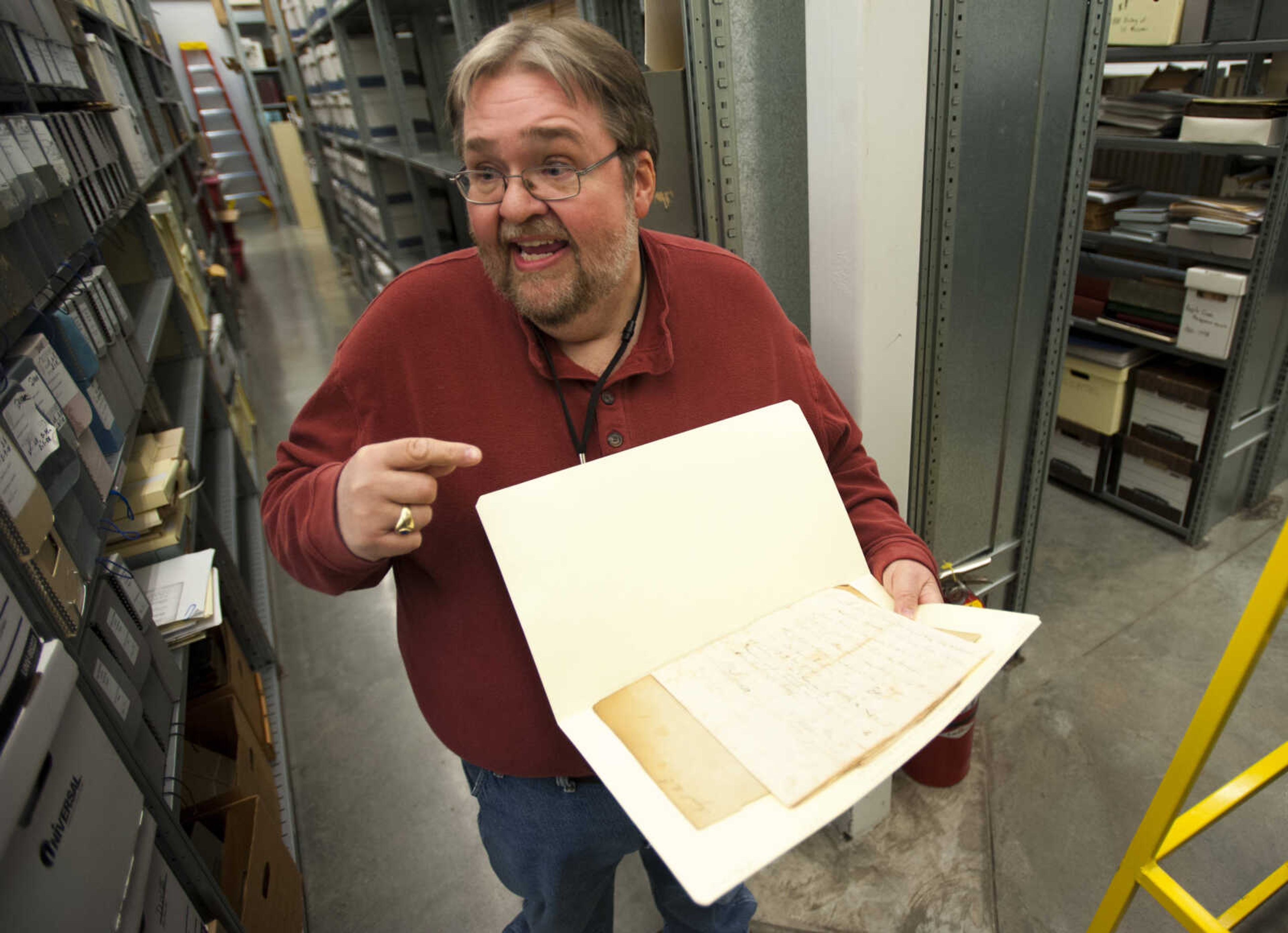 Archive director Steve Pledger shows a 1799 letter sent by Josiah Lee to Louis Lorimier at Cape Girardeau County Archive Center on Thursday, March 8, 2018, in Jackson. In the letter, Lee requests to be allowed back into Spain after being removed from the country by Lorimier.