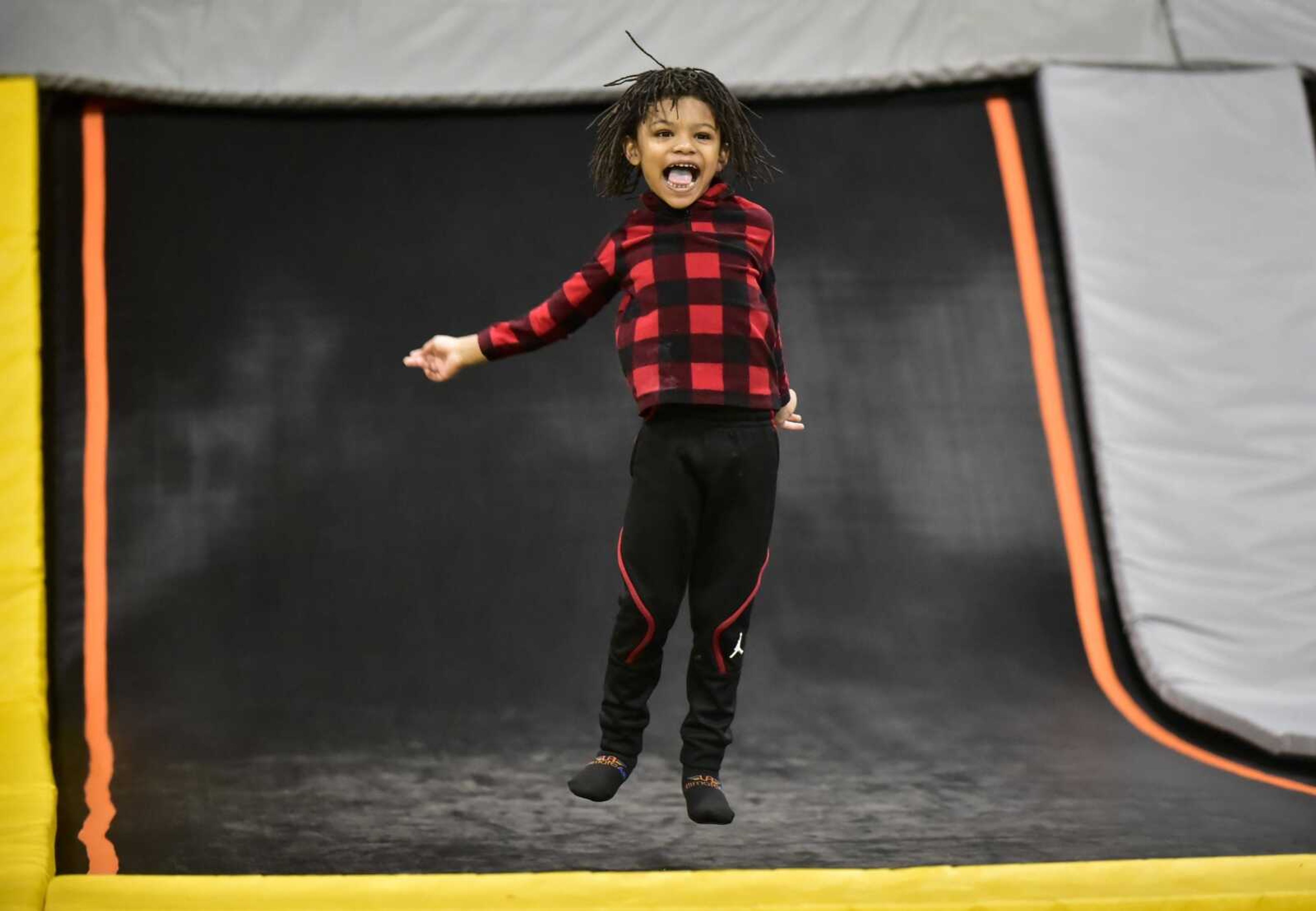 Linny Reid, 6, bounces on a trampoline Tuesday, Feb. 13, 2018, during an Easterseals Midwest monthly outing at Ultimate Air Trampoline Park in Scott City.