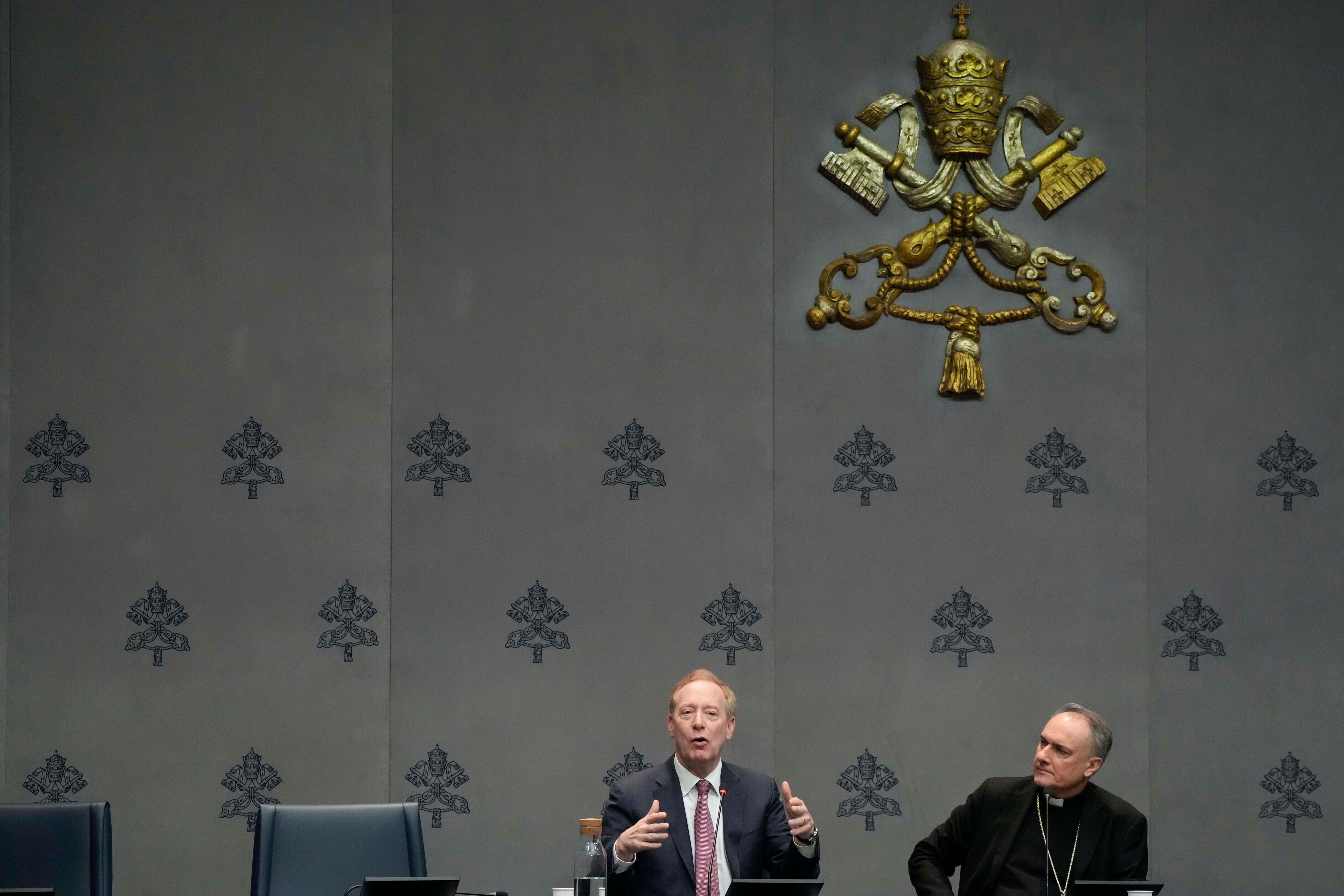 Cardinal Mauro Gambetti, right, and Microsoft's vice-Chairman and President Brad Smith unveil the project "St. Peter's Basilica: AI-Enhanced Experience" during a press conference at the Vatican, Monday, Nov. 11, 2024. (AP Photo/Gregorio Borgia)