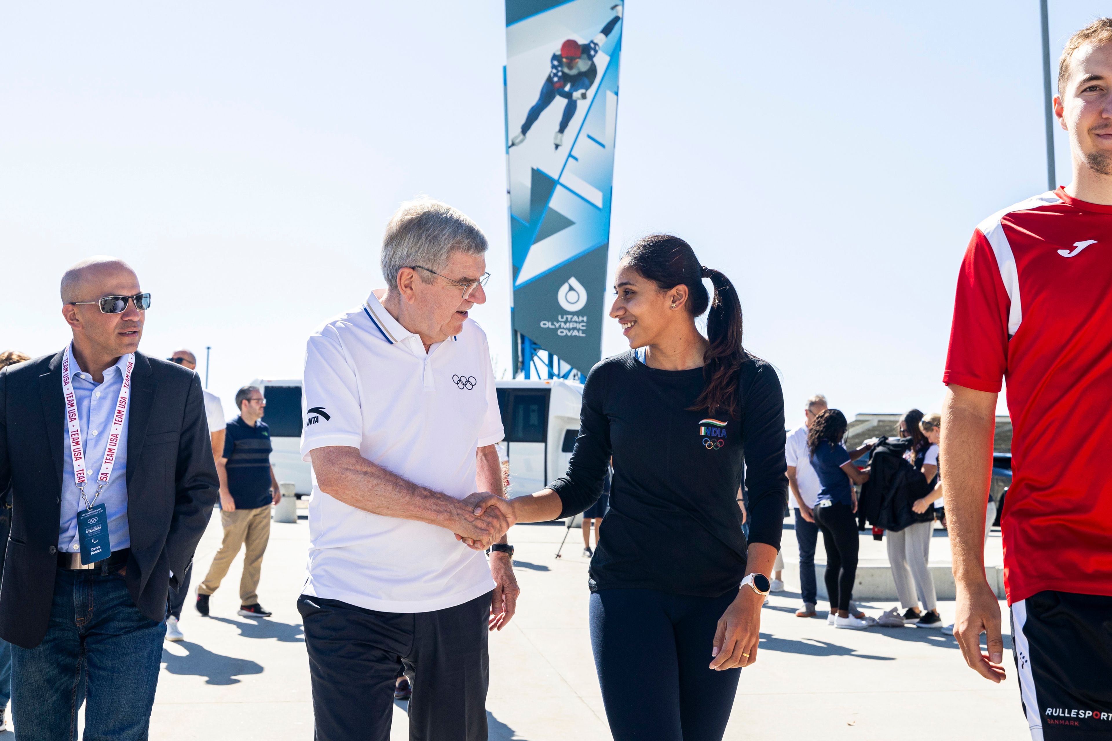 International Olympic Committee President Thomas Bach talks with long-track speedskater Shruti Kotwal as they walk toward the Utah Olympic Oval in Kearns, Utah, Saturday, Sept. 28. 2024. (Isaac Hale/The Deseret News via AP)